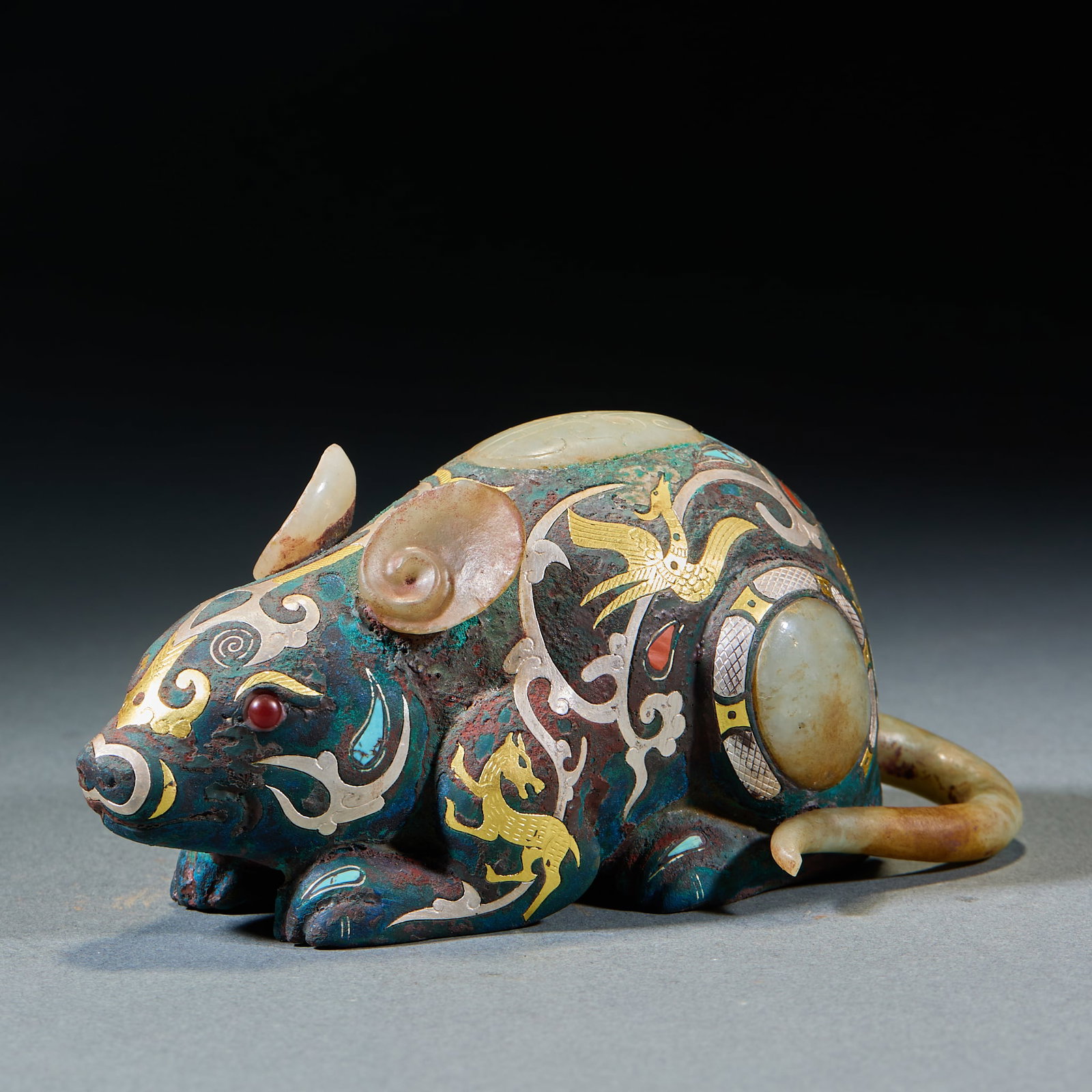 Warring States-Han Gold-Silver Inlaid Jade Rat Zodiac Ornament: Warring States-Han Gold and Silver Inlaid Jade Rat Zodiac Ornament: Cast bronze gold and silver inlaid ornament fully inlaid with Hetian jade, agate, turquoise and other gemstones, decorated with phoe