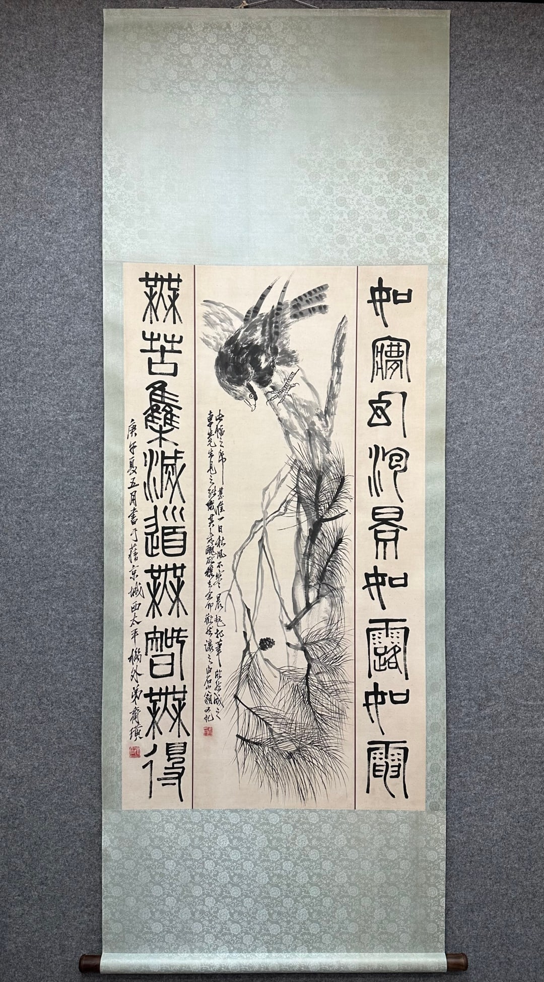 Qi Baishi Paper Central Scroll of Pine and Eagle: Qi Baishi Pine Eagle Paper Central Scroll: Paper color pine eagle painting with vigorous bold brushwork, vigorous eagle upright pine branches, paired seal script couplets on both sides, complete inscr