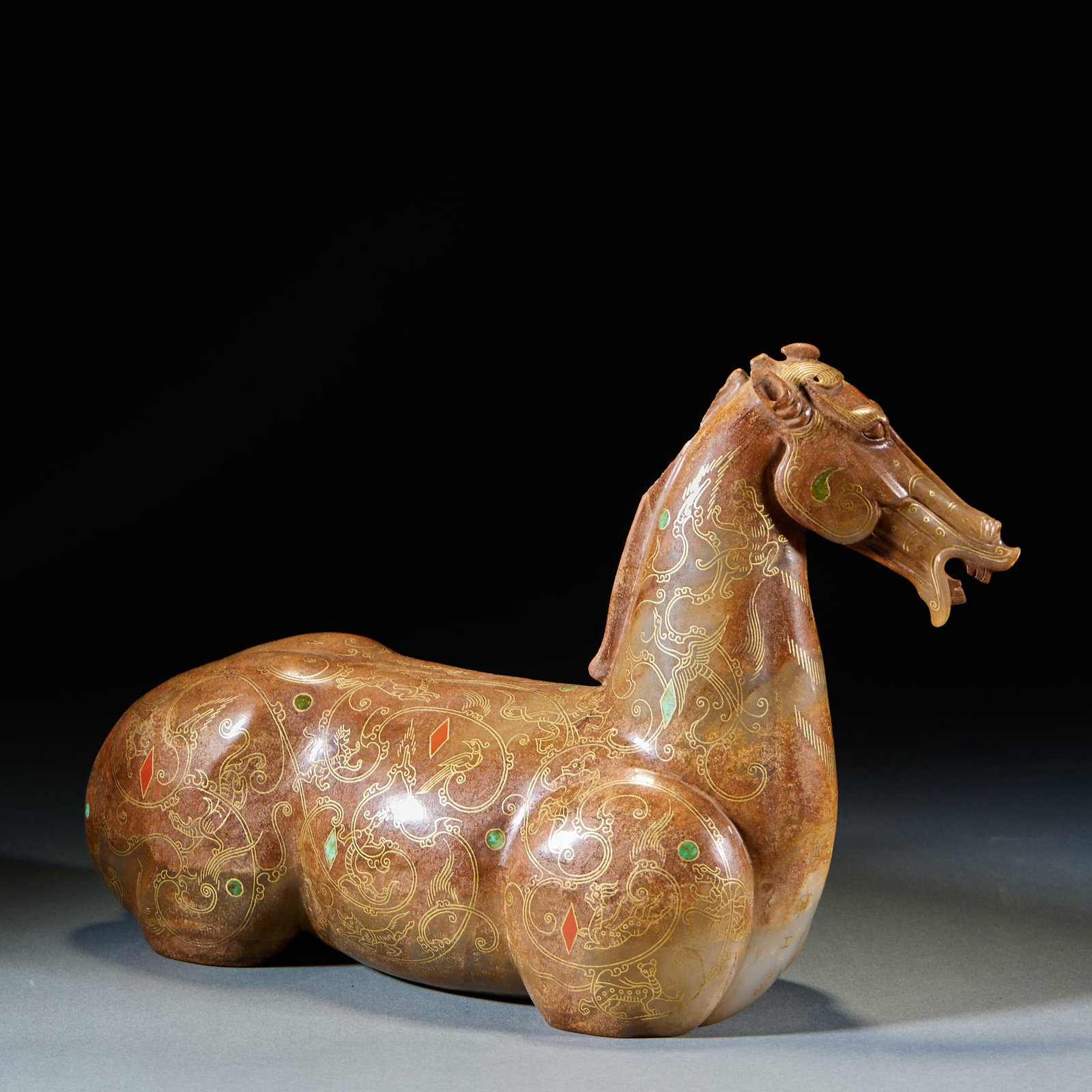 Ancient Jade Gold-Inlaid Horse: Ancient Jade Gold-Inlaid Horse: Material is ancient jade with warm texture and natural infiltration. Crafted with gold-silver inlay and turquoise & ruby inlay, carved as lying horse with full scroll