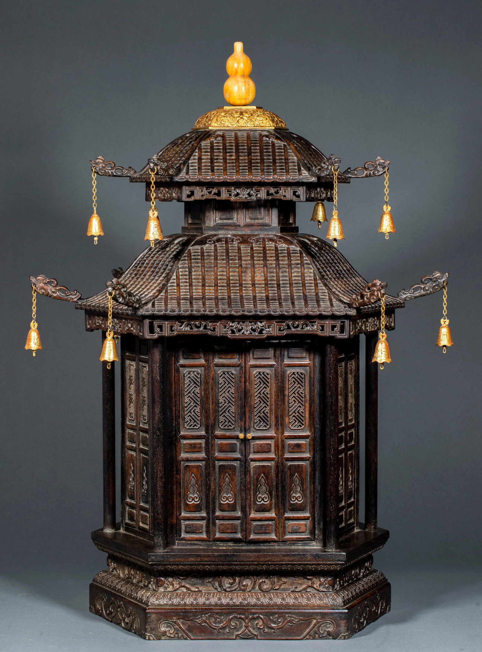 Small Leaf Rosewood Buddhist Shrine: Small Leaf Rosewood Buddhist Shrine: Material is small leaf rosewood, crafted with mortise and tenon structure, openwork/relief carving into a pavilion-like shape, gilt gourd knop on the top cover, go