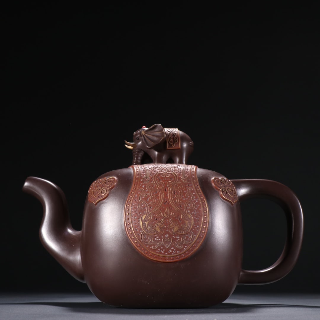 Purple Sand Gilded "Peace with Elephant" Teapot, Mark of Chen Mingyuan: Purple Sand Gilded "Peace with Elephant" Teapot, Mark of Chen Mingyuan: Material is purple clay, crafted with Chen Mingyuan’s classic bionic techniques, elephant knop on the lid (implying peace