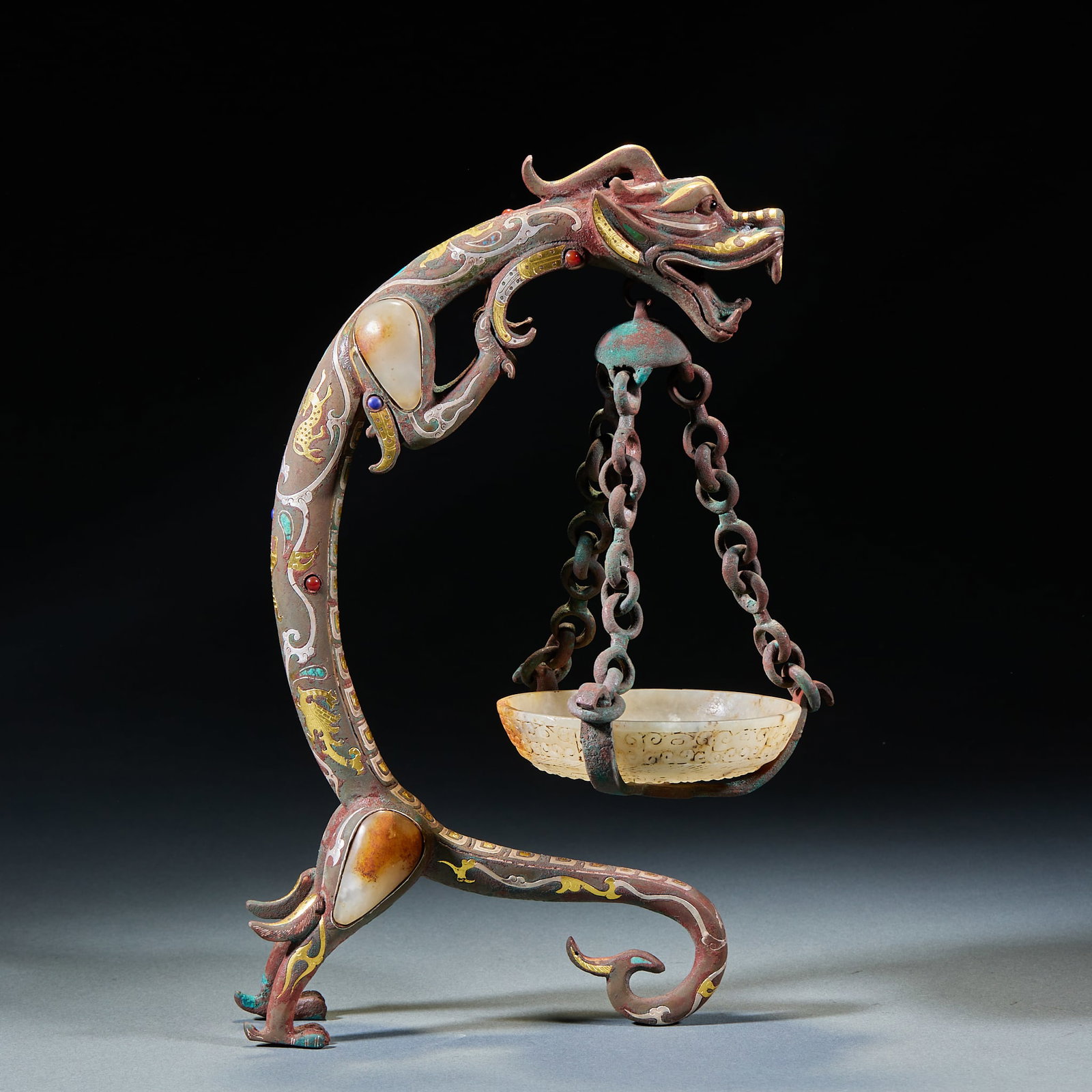 Gold and Silver Inlaid Jade and Gem Dragon-Shaped Incense Lamp, Warring States to Han Dynasty: Gold and Silver Inlaid Jade and Gem Dragon-Shaped Incense Lamp, Warring States to Han Dynasty: Material is bronze. Inlaid with gold, silver, jade and gems in dragon-shaped incense lamp, complex and ex