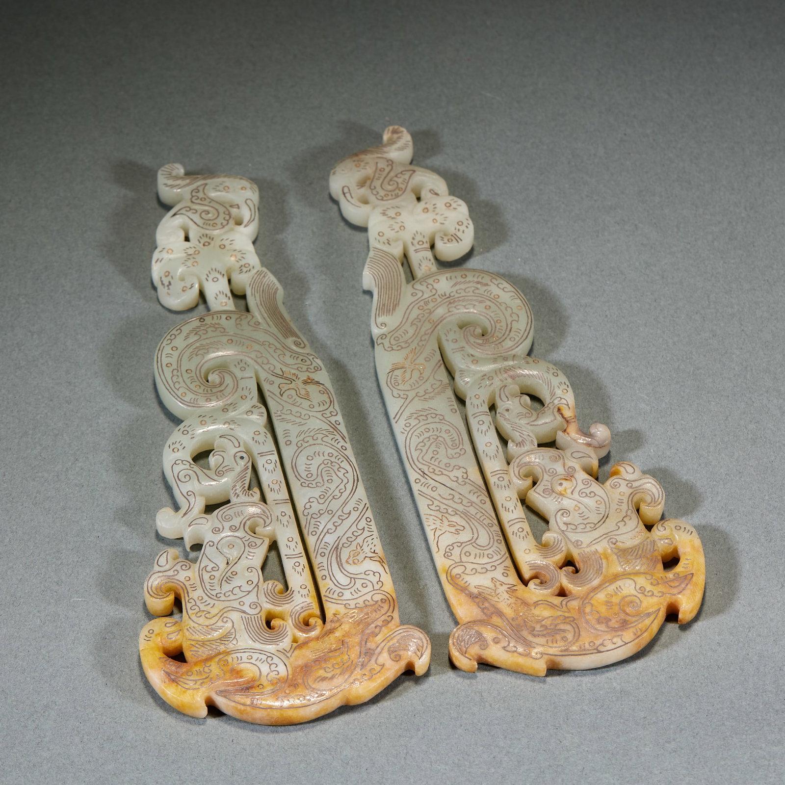 Pair of Gold and Silver Inlaid Phoenix Head Jade Bi: Pair of Gold and Silver Inlaid Phoenix-Head Jade Bi: Material is Hetian jade. Crafted with gold and silver inlay, carved with phoenix-head and auspicious beast patterns, well preserved in pair. Size: