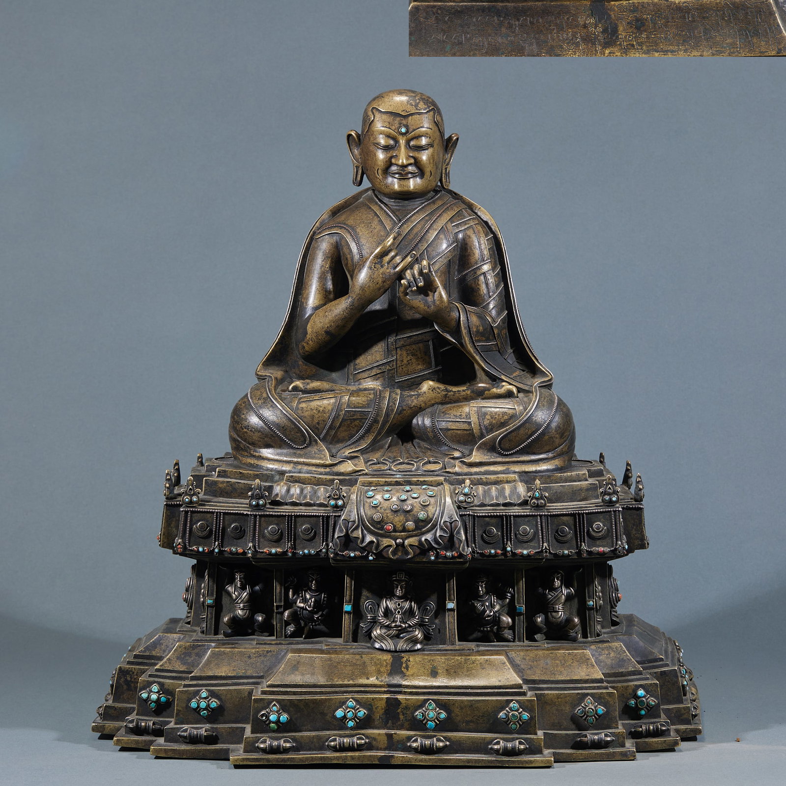 Alloy Copper Guru Buddha Statue: Alloy Copper Seated Guru Buddha Statue: Material is alloy copper. Crafted with casting and carving of seated Guru Buddha, solemn face, smooth robe lines, gem inlaid. Size: Height 55cm, Length 49cm,