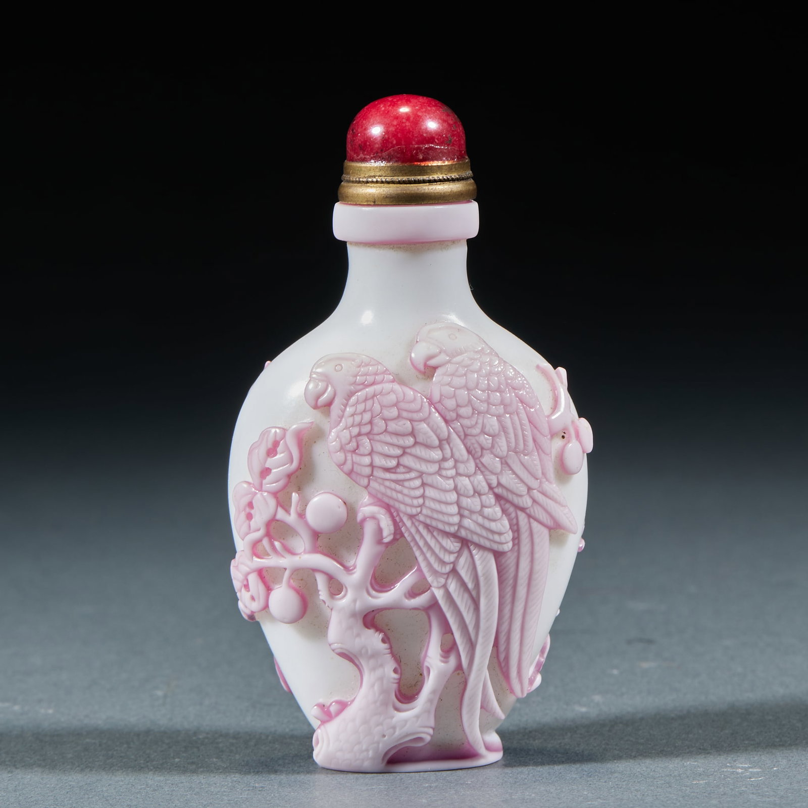 Peking Glass Magpie upon Plum Blossom Snufff Bottle: Peking Glass Magpie upon Plum Blossom Snuff Bottle: Made of overlay Peking glass, relief carved with parrot and flower patterns implying auspicious blessing of magpie announcing good news, fitted with
