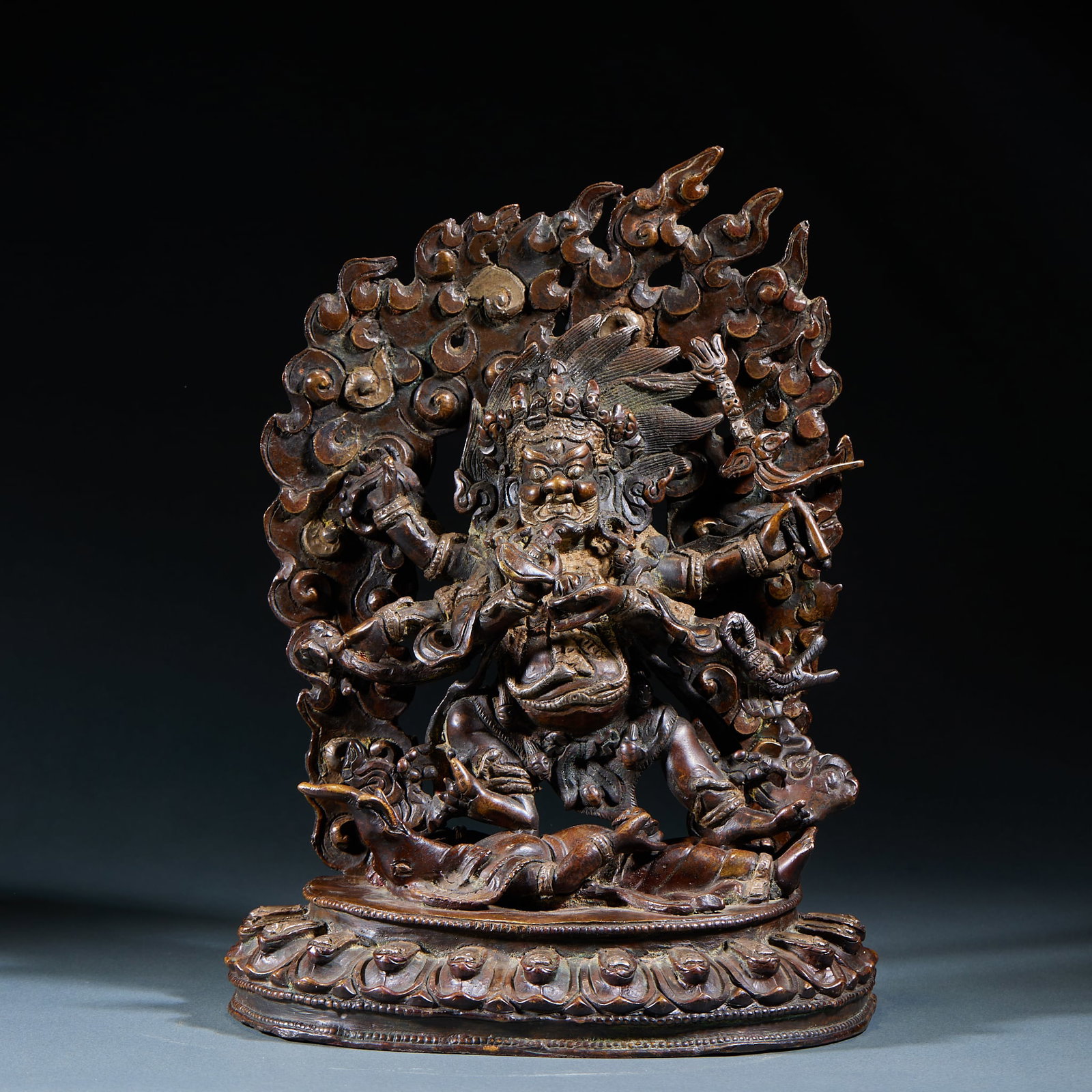 Bronze Mahakala Statue: Bronze Mahakala Statue: Cast bronze Mahakala Dharma protector statue with powerful posture, intricate patterns and mellow patina. Specifications: height 26.5cm, length 20.5cm, width 11cm. Cultural val