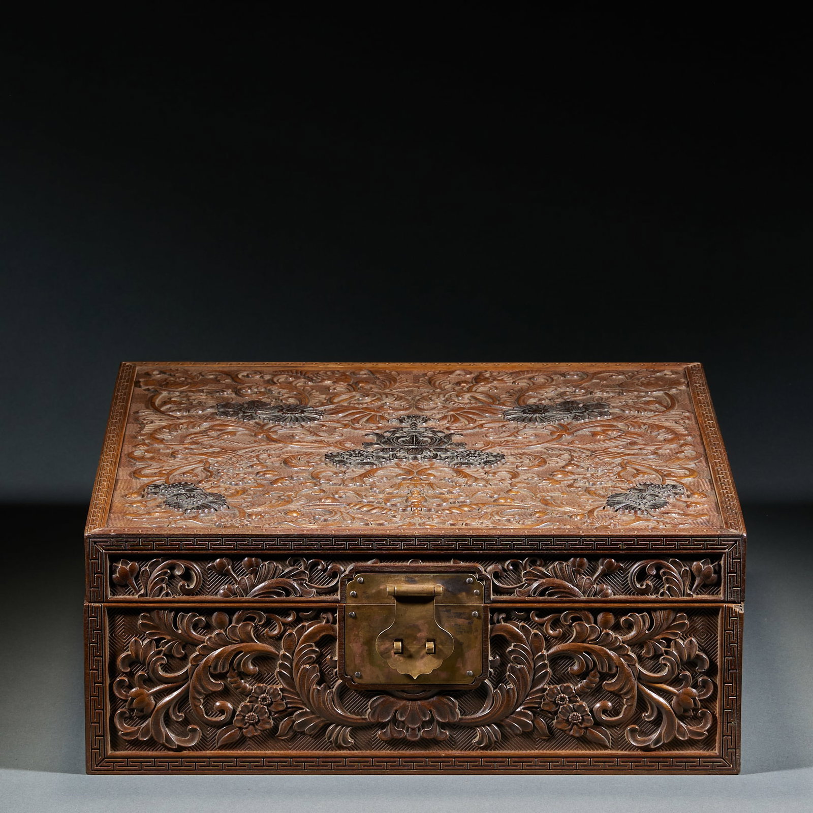 Huanghuali Jewelry Box: Huanghuali Jewelry Box: Huanghuali wood fully carved with interlocking lotus patterns, fitted with copper hardware, clear wood grain and mild patina. Specifications: height 14cm, length 36cm, width 36