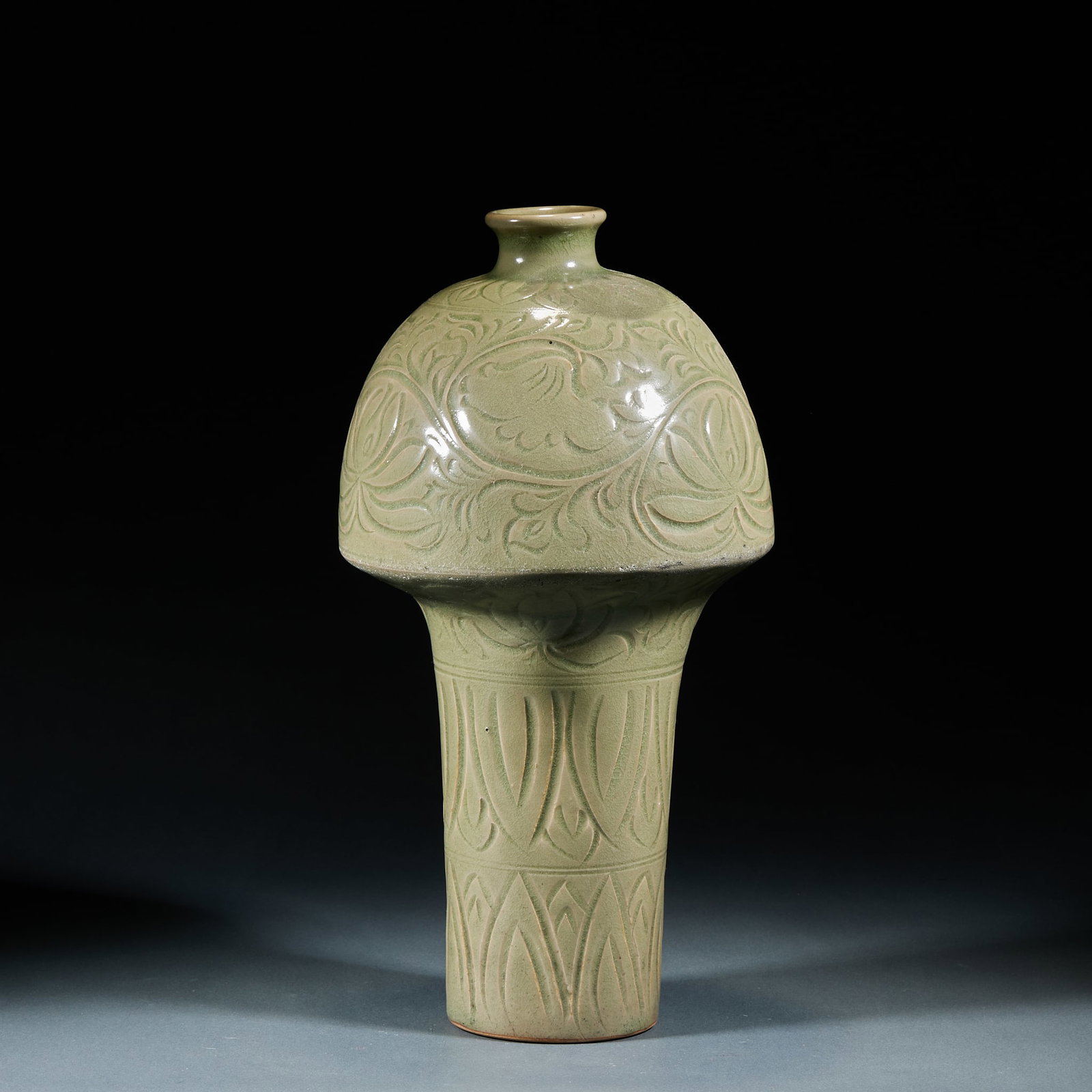 Yaozhou Kiln Mushroom Shaped Meiping Vase: Yaozhou Kiln Mushroom Shaped Meiping Vase: Yaozhou celadon fully carved with interlocking flower patterns in unique mushroom shape. Specifications: height 35cm, belly diameter 19cm. Cultural value: