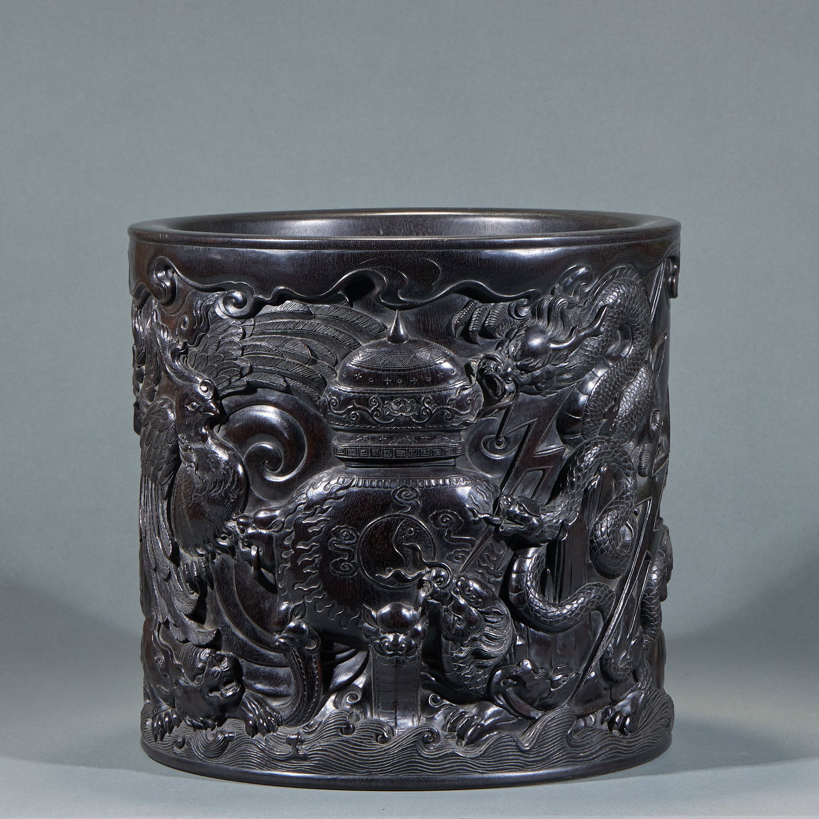Red Sandalwood Dragon and Phoenix Cylinder Vase: Red Sandalwood Dragon and Phoenix Cylinder Vase: Carved of whole red sandalwood with dragon and phoenix auspicious patterns, exquisite refined carving. Specifications: height 31cm, diameter 32.5cm.