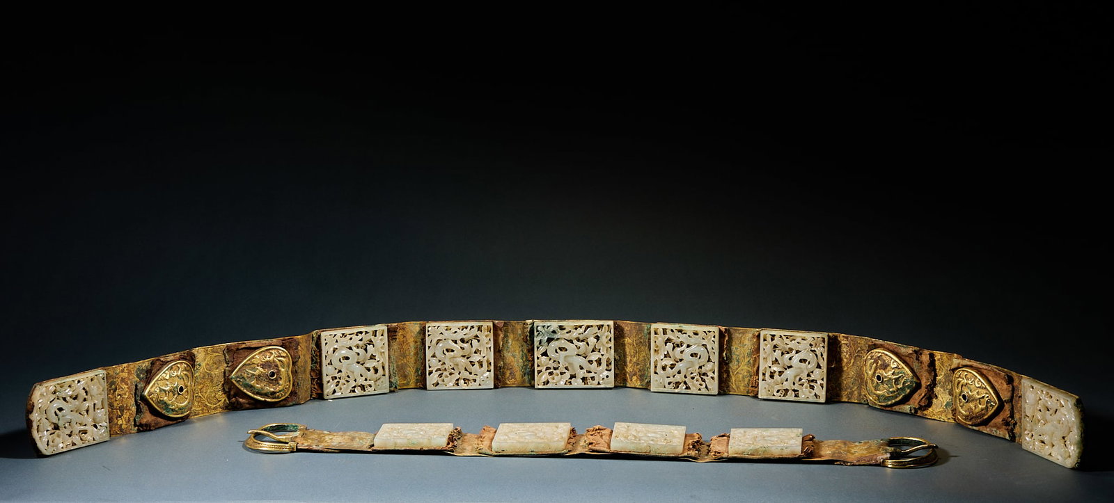 Hetian Jade Gilt Jade Belt Plaque Set: Hetian Jade Gilt Belt Plaque Set: Carved of Hetian jade with openwork dragon patterns, matched with gilt components. Long ornament: length 98cm, width 5.5cm; short ornament: length 52.5cm, width 5.5cm