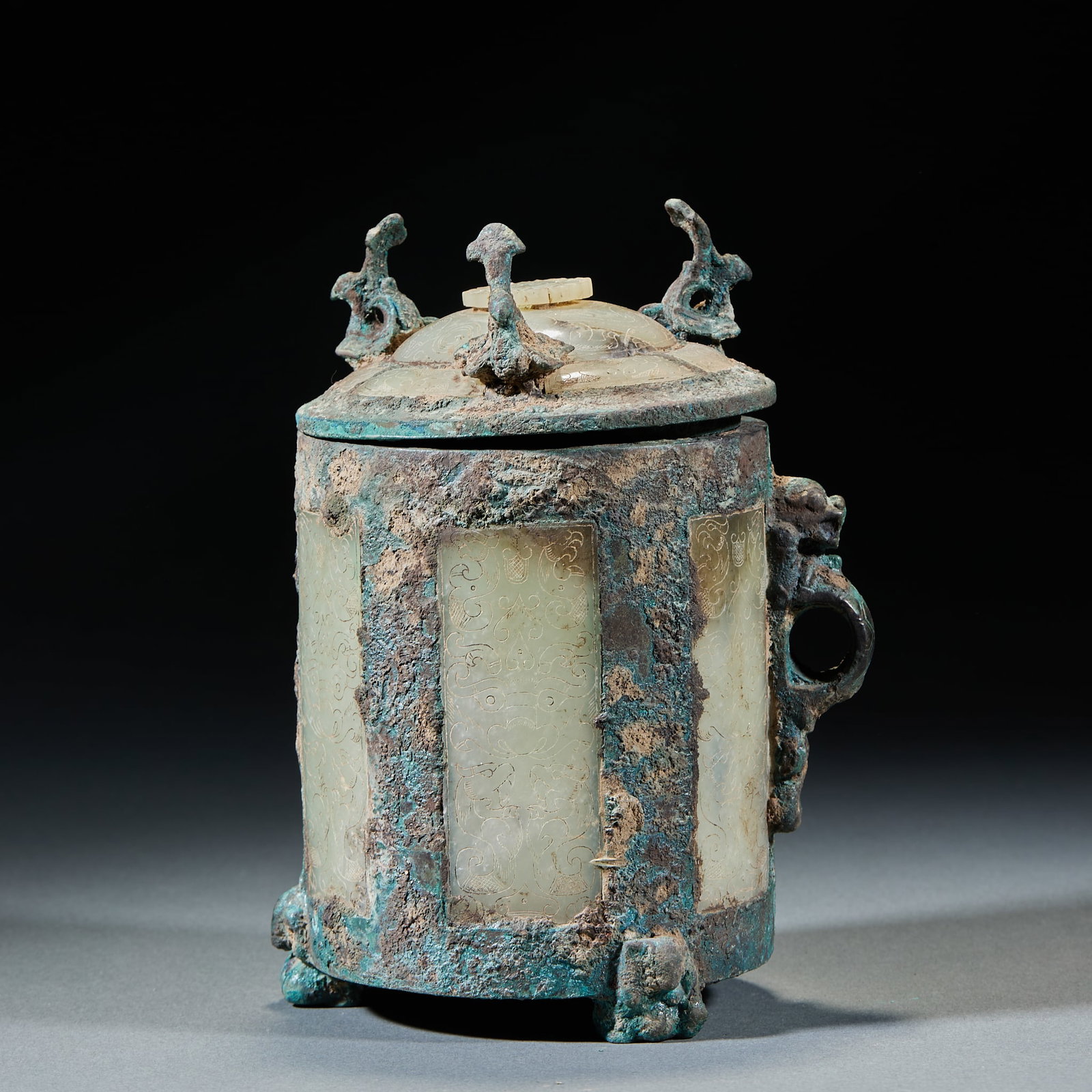 Bronze Jade Inlaid Zun Vessel: Bronze Jade Inlaid Zun Vessel: Cast in bronze with jade sheet inlay on the body in primitive elegant craft. Specifications: height 18cm, diameter 11cm. Cultural value: An ancient wine vessel. The bron