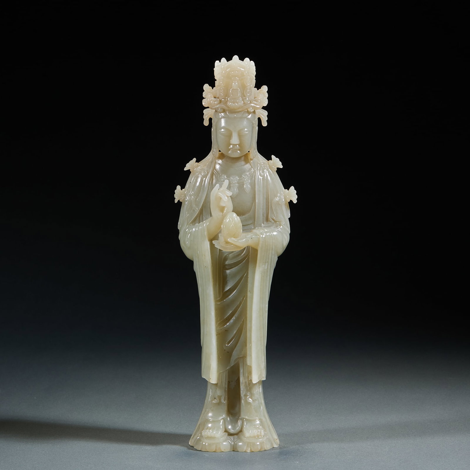 Hetian Jade Guanyin Statue: Hetian Jade Guanyin Statue: Made of mild fine Hetian jade, crafted via round carving technique with dignified Guanyin facial features, flowing robe lines and well-proportioned statue form. Specificati
