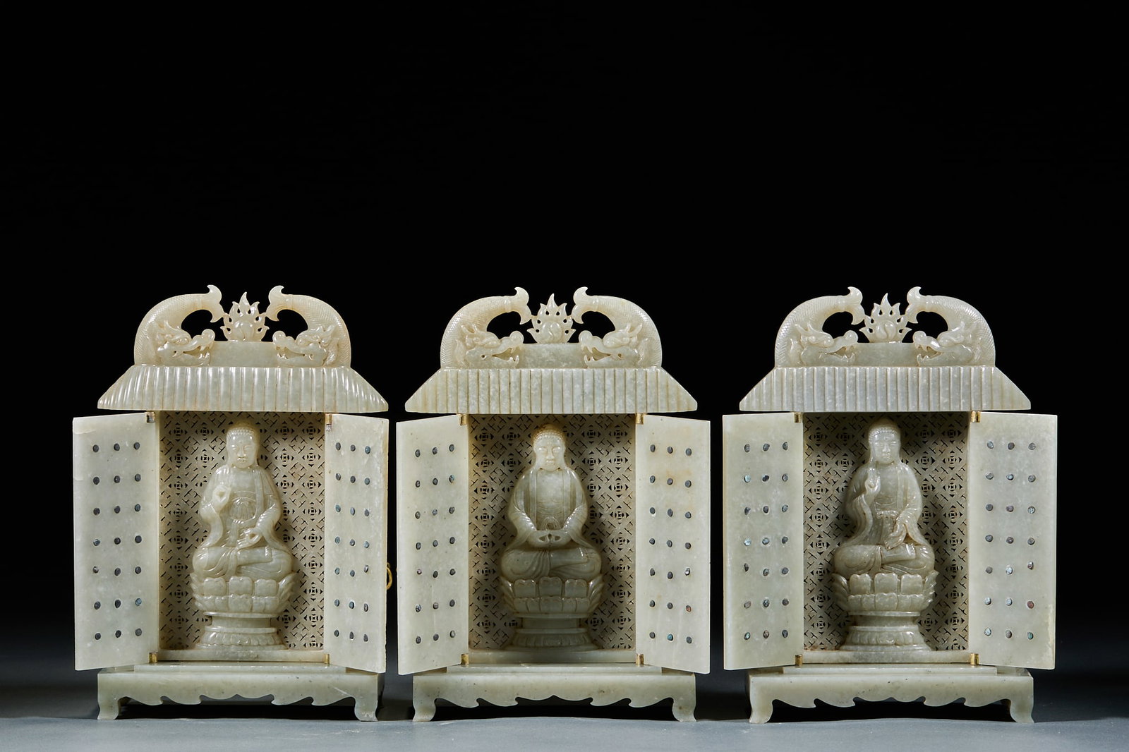 Hetian Jade Sakyamuni Buddha Niche Set, Three Pieces: Hetian Jade Sakyamuni Buddha Niche Set, Three Pieces: Crafted of Hetian jade via openwork and round carving techniques, exquisitely hollowed niche patterns and dignified Buddha carving with fine workm