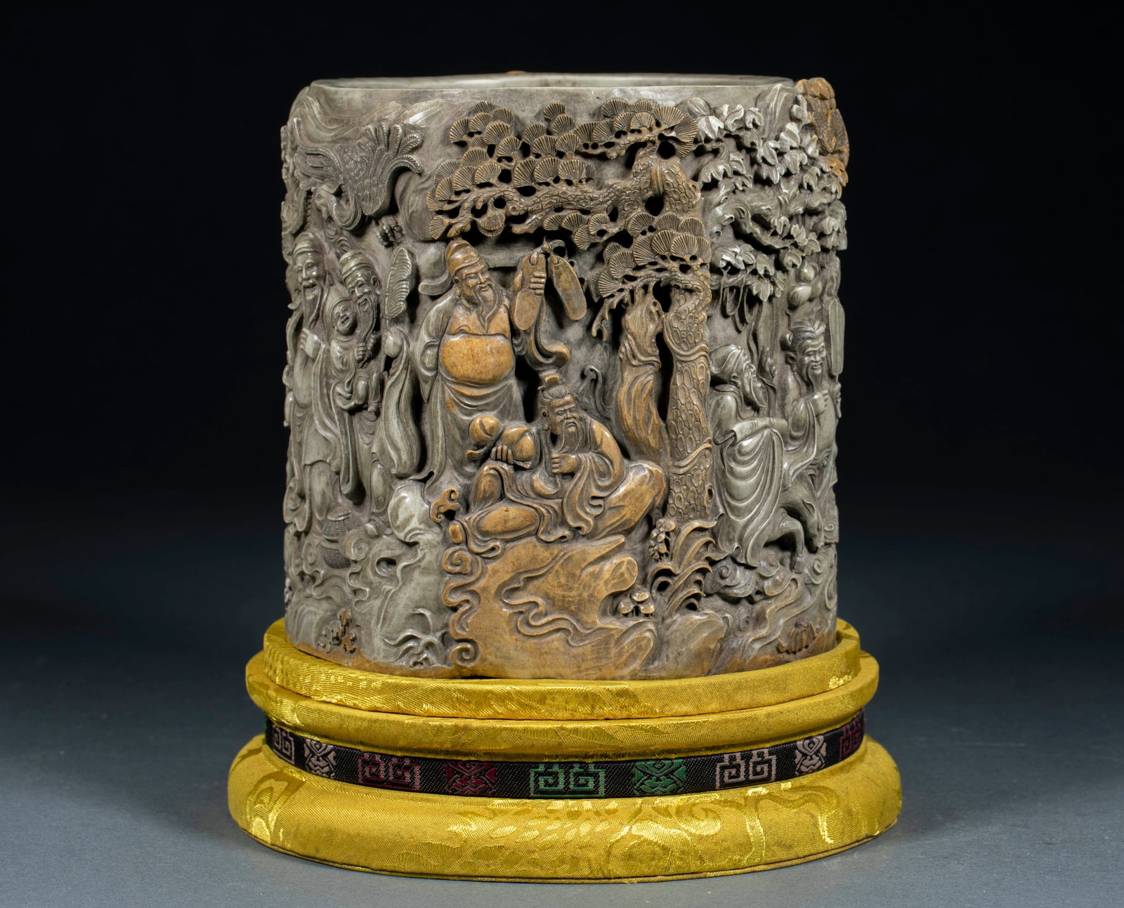 Shoushan Stone Exquisitely Carved Eight Immortals Brush Pot: Shoushan Stone Exquisitely Carved Eight Immortals Brush Pot: Shoushan stone crafted via deep relief technique, body fully carved with Eight Immortals, pine and cypress patterns with distinct figure