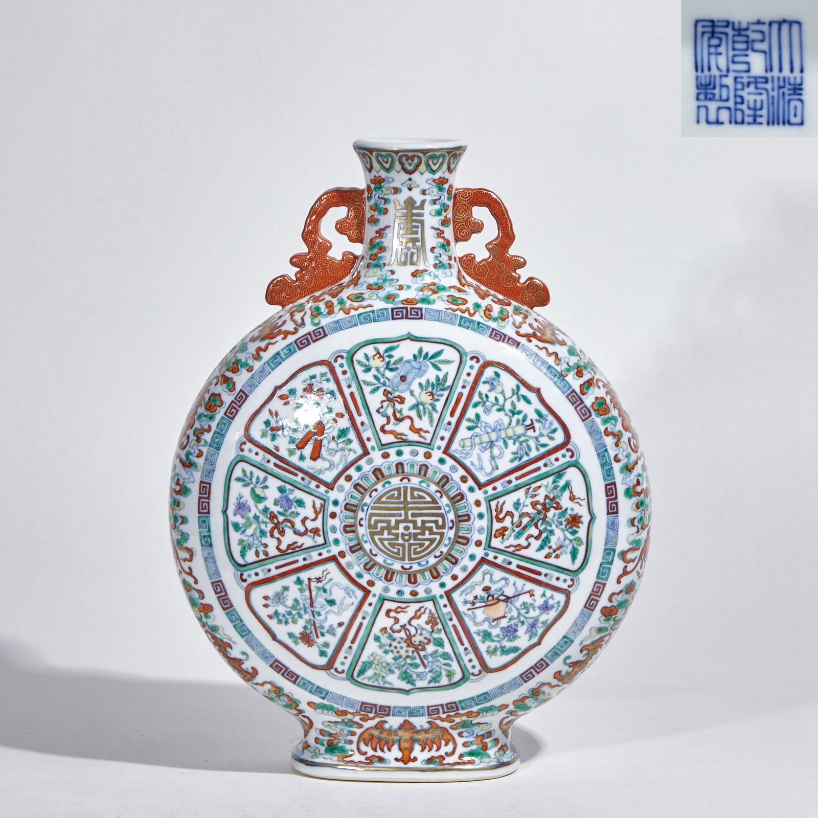 Qianlong Period Doucai Gilt Binaural Flat Vase with Eight Treasures and Longevity Character Pattern: Qianlong Mark Doucai Gilt Eight Treasures Longevity Double-Eared Flat Vase: Porcelain body crafted in doucai and gilt techniques, eight-lotus-panel reserved windows decorated with Eight Treasures and
