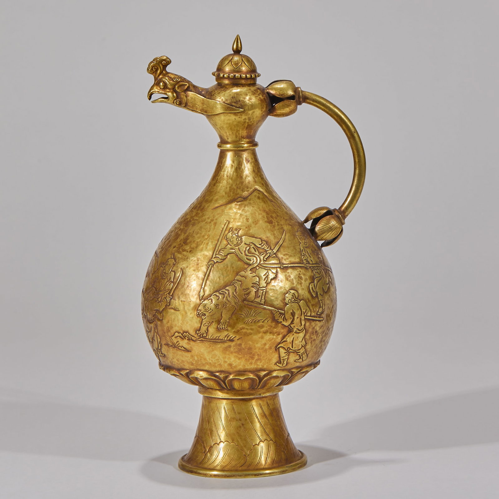 Pre-Ming Gold Phoenix Head Ewer with Khitan Hunting Figure Pattern: Pre-Ming Gold Phoenix Head Ewer with Khitan Hunting Pattern: Pure gold crafted via hammering and chasing techniques, phoenix-head spout, body chased with vivid Khitan hunting scenes, mild aged patina.
