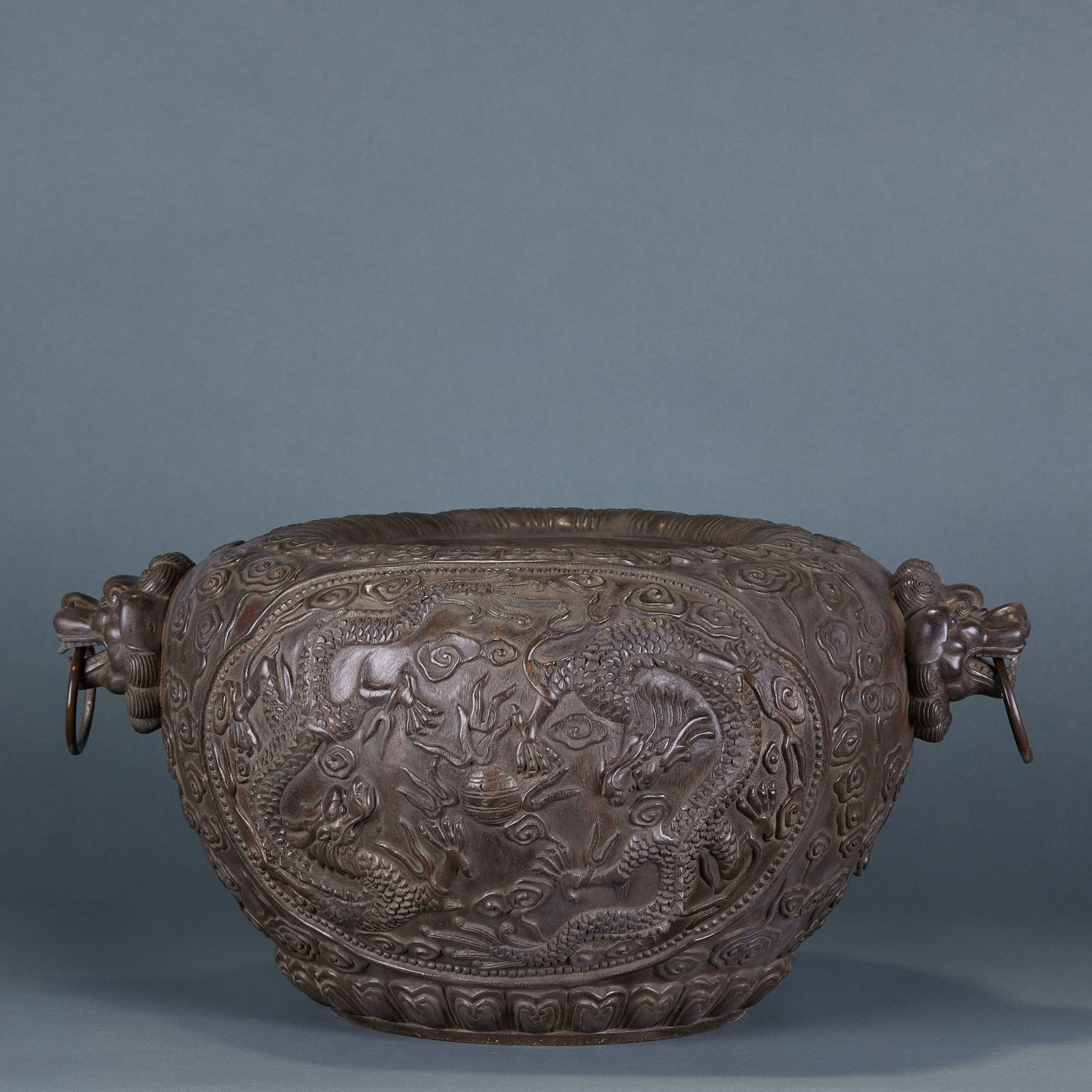 Agarwood Dragon Cloud Pattern Double Lion Ear Censer: Agarwood Cloud Dragon Pattern Double Lion Ear Censer: Round carved from single agarwood log, body relief carved with dragon and cloud patterns, primitive double lion ear design and mild natural