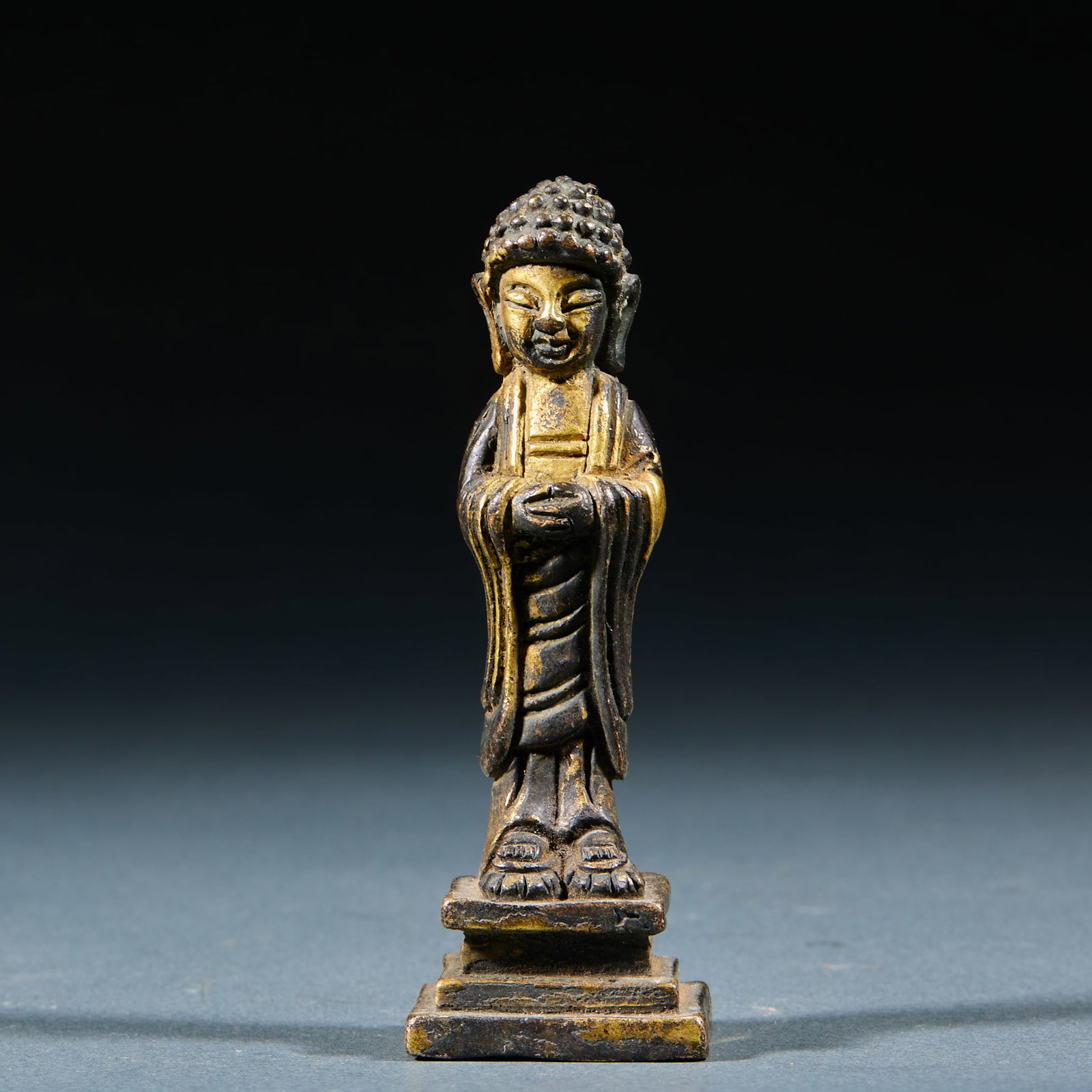 Gilt Bronze Standing Sakyamuni Statue: Gilt Bronze Sakyamuni Standing Statue: Regular gilt bronze casting craft, dignified Sakyamuni figure with flowing robe lines and well-preserved gilding. Specifications: height 8.5cm, length 2.8cm, wid