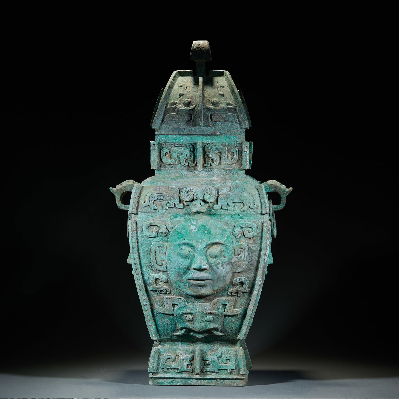 Western Zhou Dynasty Divine Mask Bronze Square Lei: Western Zhou Divine Mask Bronze Square Lei: Majestic monumental form, relief-carved divine mask emblems with imposing aura and naturally aged patina. Height 80cm, length 47cm, width 21cm. A paramount 