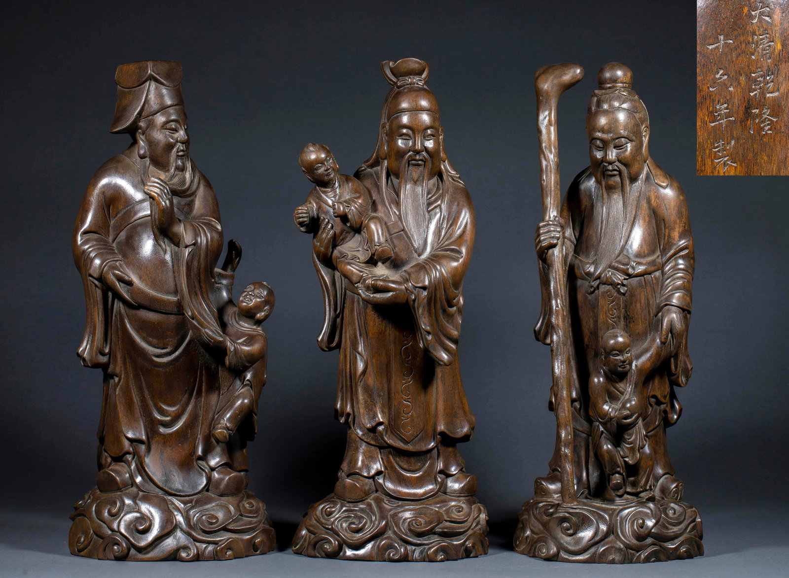 Qing Agarwood Fortune Longevity and Prosperity Ornament: Qing Agarwood Fu-Lu-Shou Three Deities Statue: Fully carved from single agarwood log. Flowing robe lines, vivid facial expressions and mild natural patina bearing auspicious symbolism. Height 52cm, le