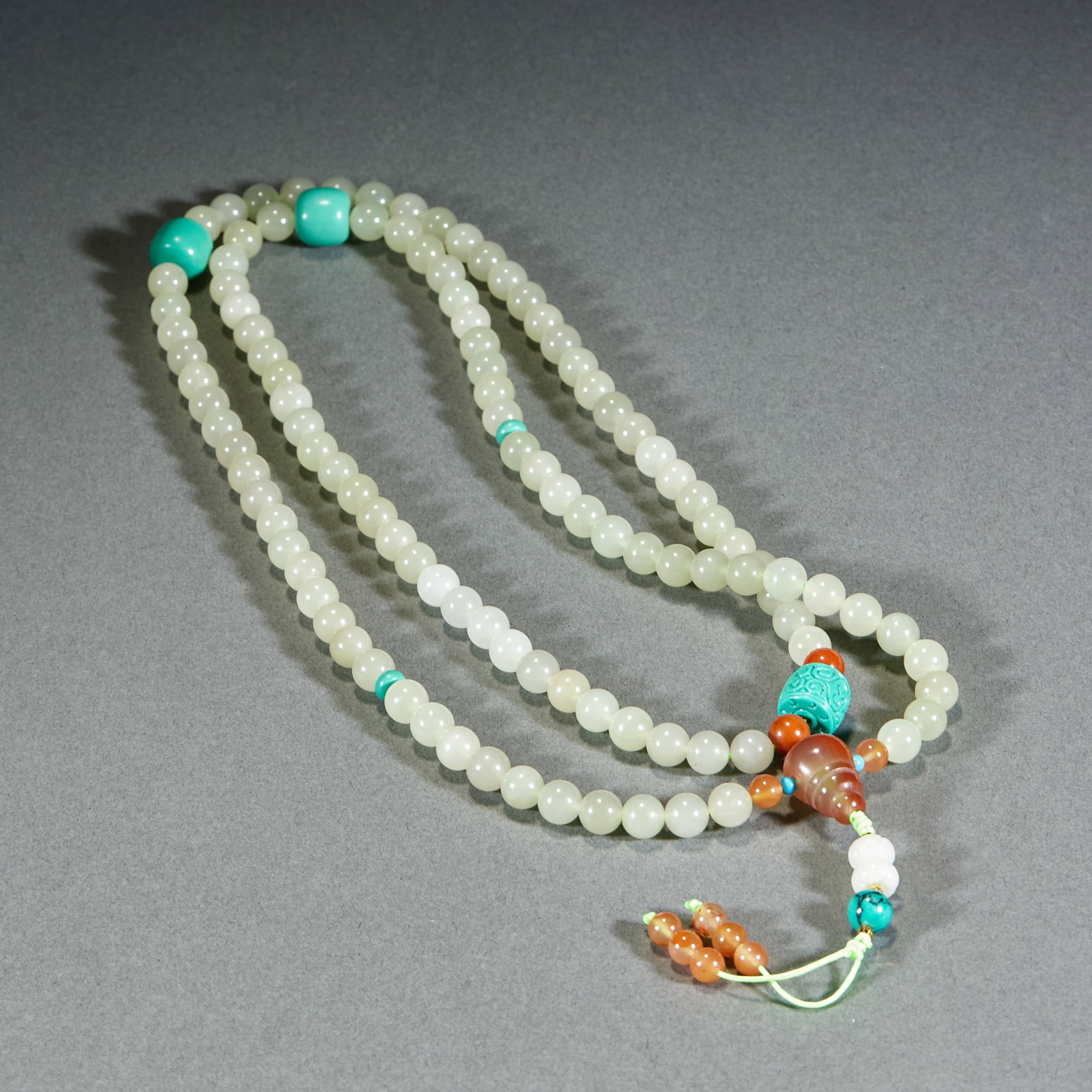 Hetian Jade Neck Ornament: Hetian Jade Necklace Ornament: Premium mild Hetian jade with evenly rounded polished beads and harmonious overall matching. Bead diameter 0.8cm, total weight 102g. A traditional jade accessory with in