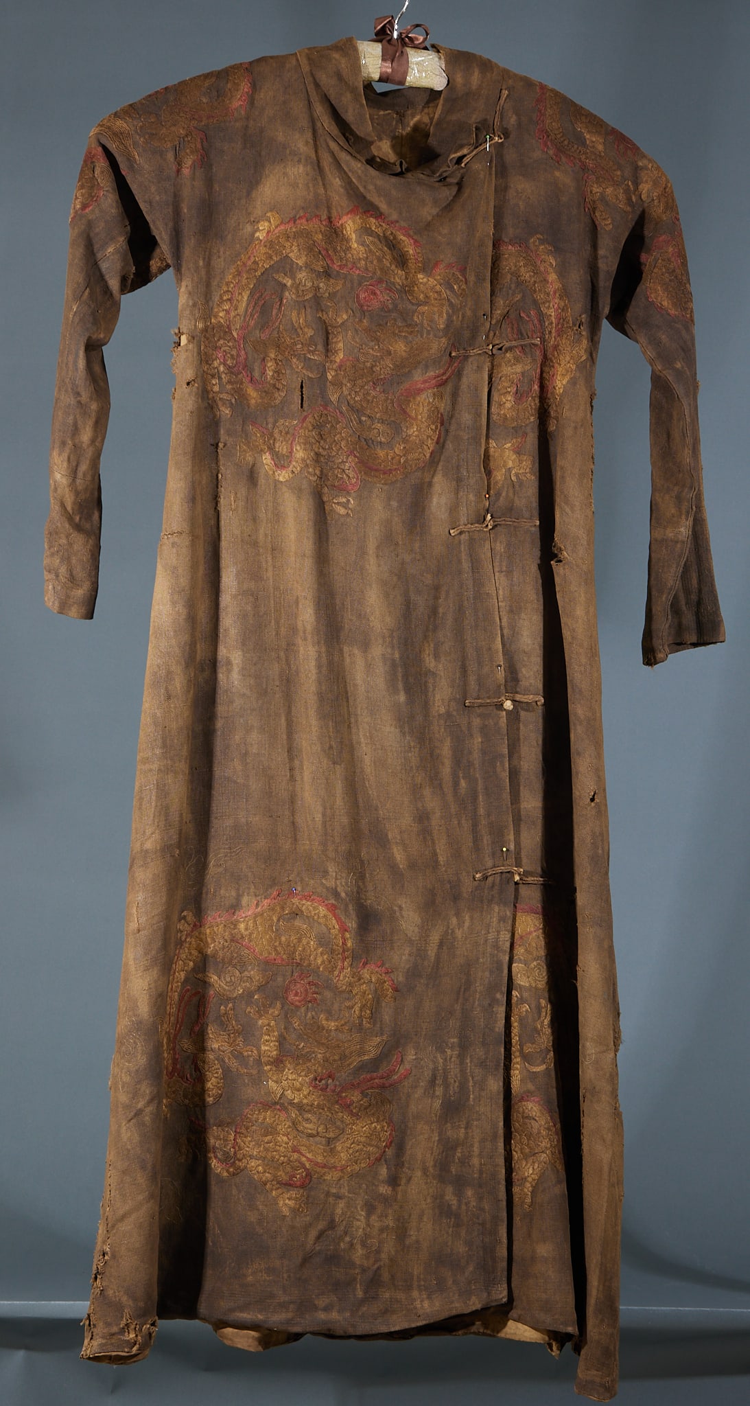 Embroidered Dragon Robe: Embroidered Dragon Robe: Silk base embroidered with fine gold and colored threads, magnificent grand dragon patterns with intricate regular ornamentation and dense exquisite stitches. Garment length 1