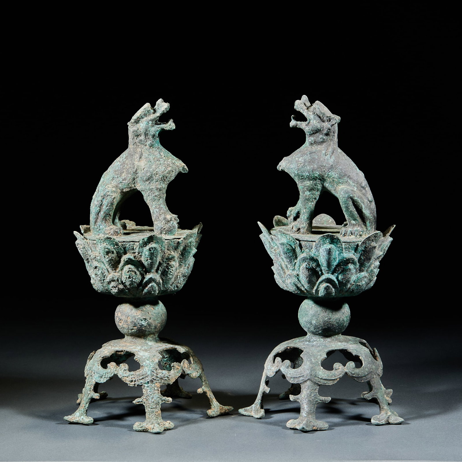 Bronze Lion Incense Burners, A Pair: Bronze Lion Incense Burner Pair: Bronze crafted in lion form with lotus throne base, primitive simple craftsmanship, perfectly preserved as a pair. Height 28.5cm, diameter 15cm. Ancient incense utensi