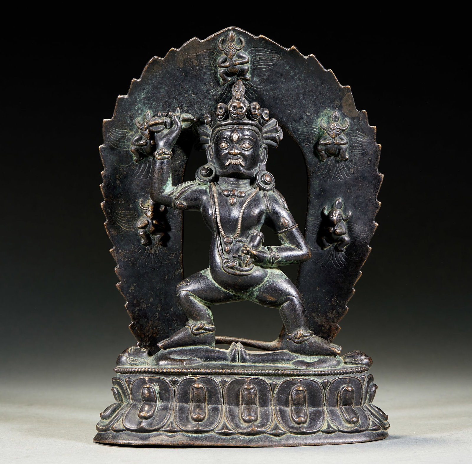 Alloy Copper Vajrapani Bodhisattva: Alloy Copper Vajrapani Bodhisattva: Alloy copper cast with imposing dignified demeanor holding ritual artifact, primitive craft with attached nimbus backdrop. Height 21cm, length 14.5cm, width 6.5cm. 