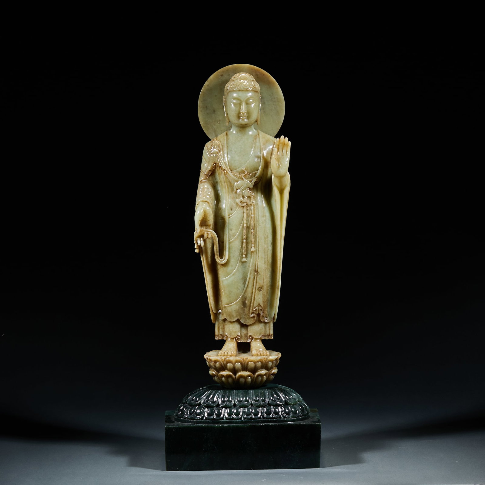 Hetian Jade Standing Sakyamuni Statue with Jasper Base: Hetian Jade Sakyamuni Standing Statue with Jasper Base: Mild fine Hetian jade fully round carved into solemn Sakyamuni standing figure with flowing robe lines, matched with jasper lotus throne base. H