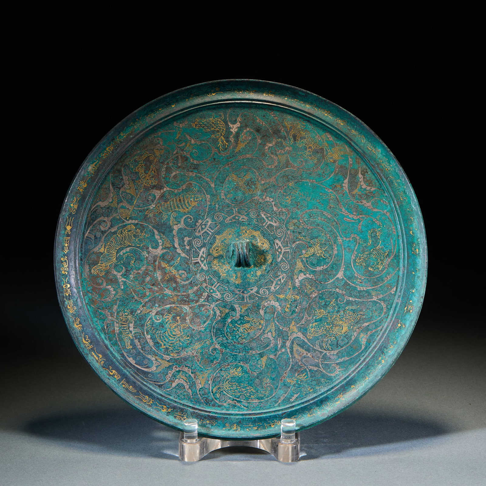 Warring States to Han Period Gold and Silver Inlaid Hunting Pattern Bronze Mirror: Warring States–Han Gold-Silver Inlaid Hunting Scene Bronze Mirror: Bronze body fully decorated with gold and silver inlay, hunting-themed patterns with smooth clear lines and natural aged patina.