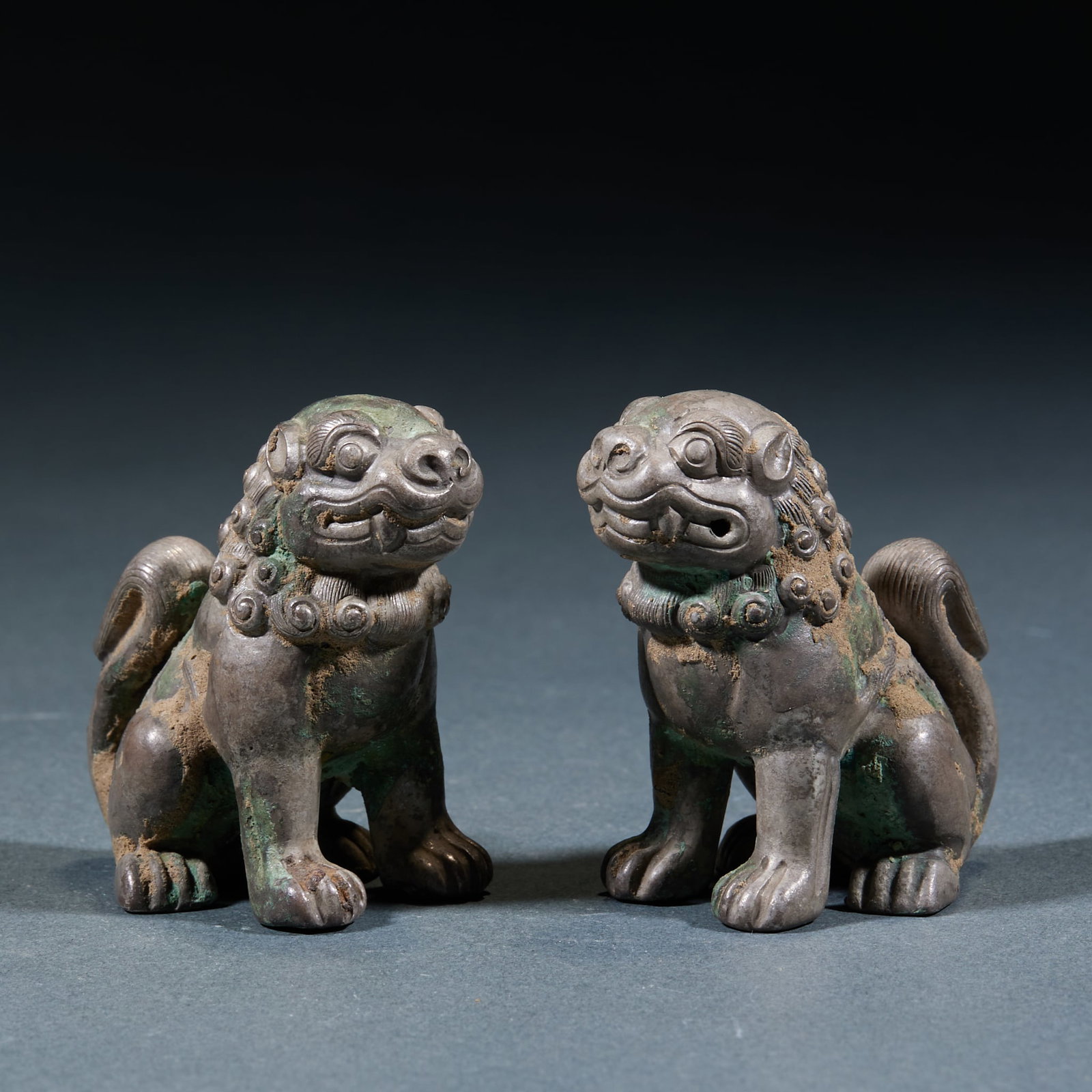 Pure Silver Lions, A Pair: Pure Silver Lion Pair: Pure silver cast with vivid lively form and smooth rounded lines, perfectly preserved as a pair. Height 4.8cm, length 4.3cm, width 2.8cm; total weight 62g. Ancient silver