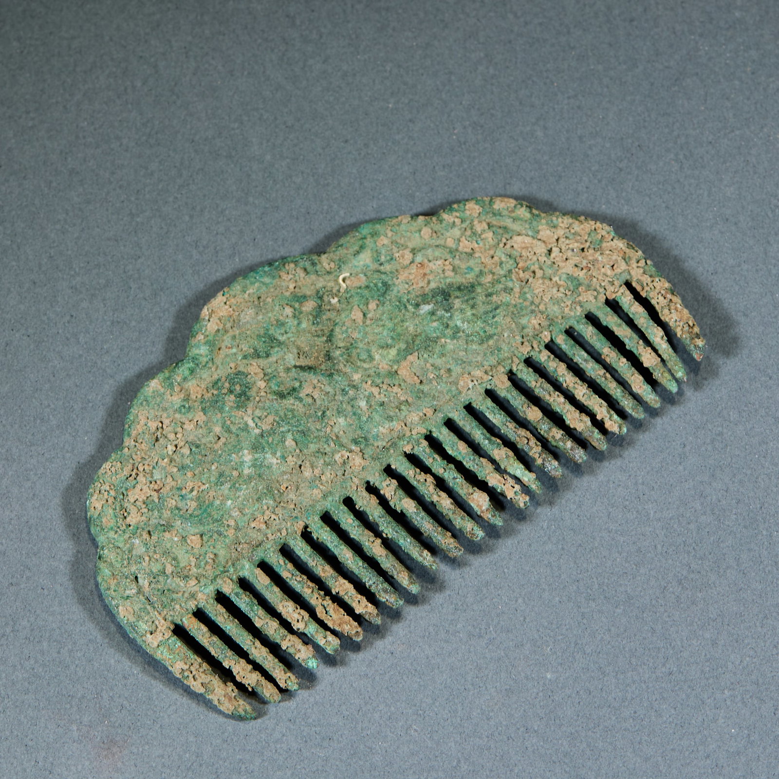 Bronze Comb: Bronze Comb: Bronze cast with neat regular comb teeth, ancient rusted patina and primitive simple craft. Length 10cm, width 6cm, weight 65g. Ancient grooming utensil providing tangible material for re