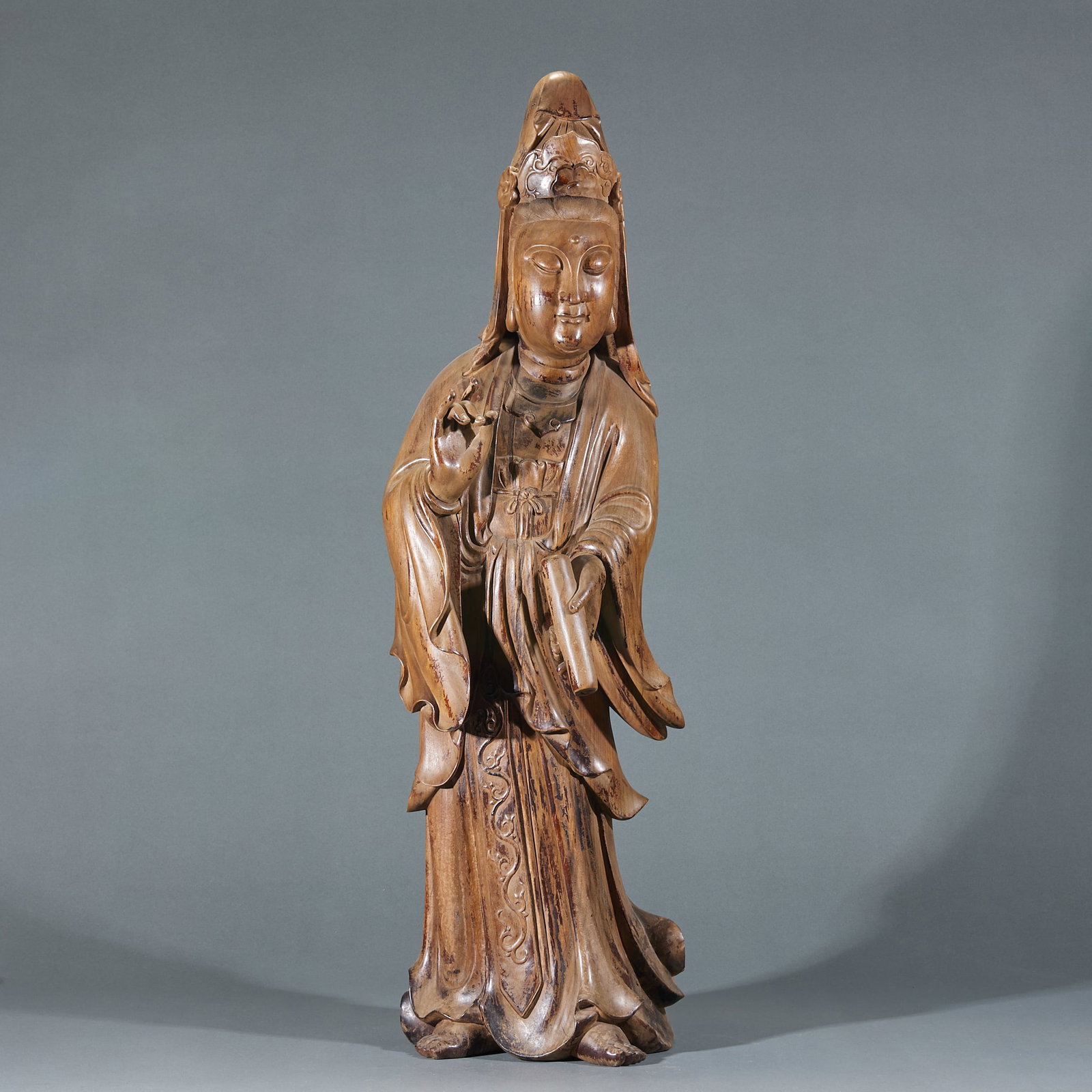Golden Nanmu Guanyin Statue: Golden Nanmu Guanyin Statue: Carved from single golden nanmu timber with dignified merciful Guanyin demeanor, flowing robe lines, distinct natural wood grain and mild warm tone. Height 85cm, length