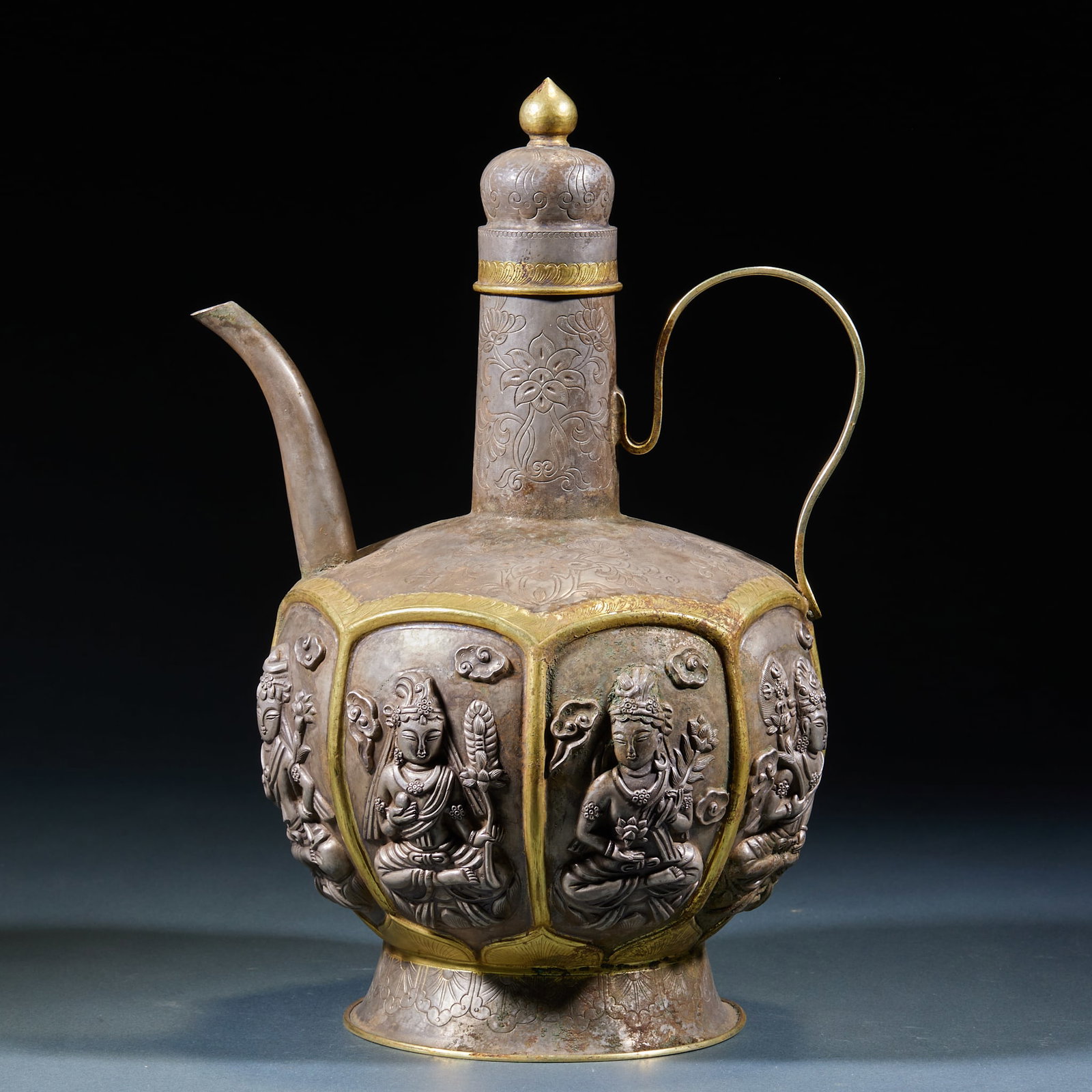 Gilt Silver Guanyin Ewer: Silver-Gilt Guanyin Pot: Silver-gilt crafted with relief Guanyin portrait on the body, exquisite workmanship and well-preserved gilding. Height 29cm, diameter 17cm, weight 858g. Fine ancient silver ar