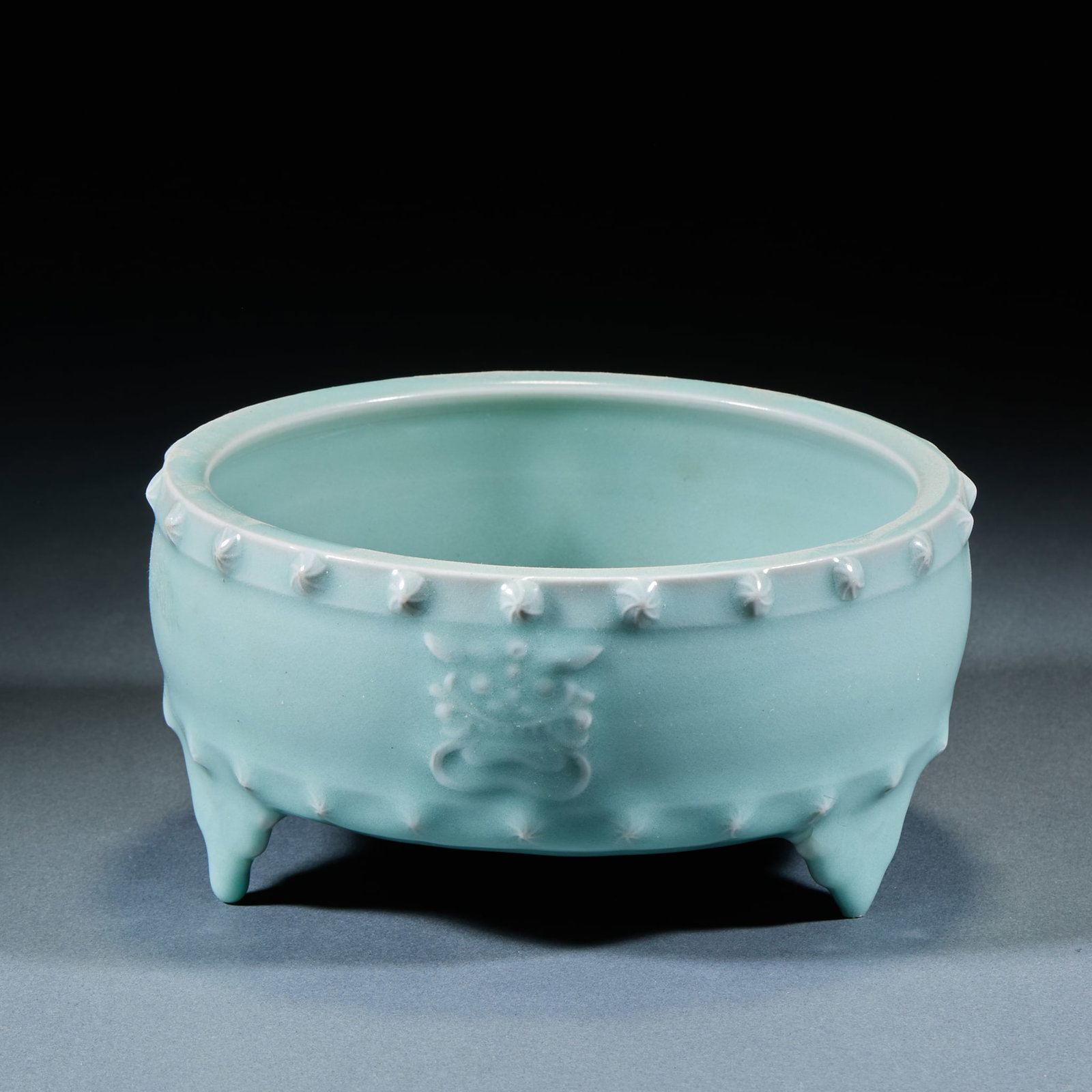Three-Foot Brush Washer: Celadon Three-Foot Brush Washer: Porcelain body with mild lustrous glaze, neat regular vessel form supported by three feet, unmarked base. Height 8cm, diameter 17cm. Elegant literati study ornament