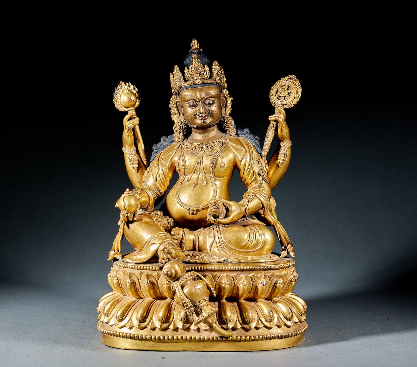 Yongle Mark Gilt Bronze Four-Armed God of Wealth: Ming Yongle Gilt Bronze Four-Armed God of Wealth: Gilt bronze cast with rigorous religious iconography and four-armed form, thick full gilding finish. Height 33cm, length 21cm, width 21cm. Ming Tibeta