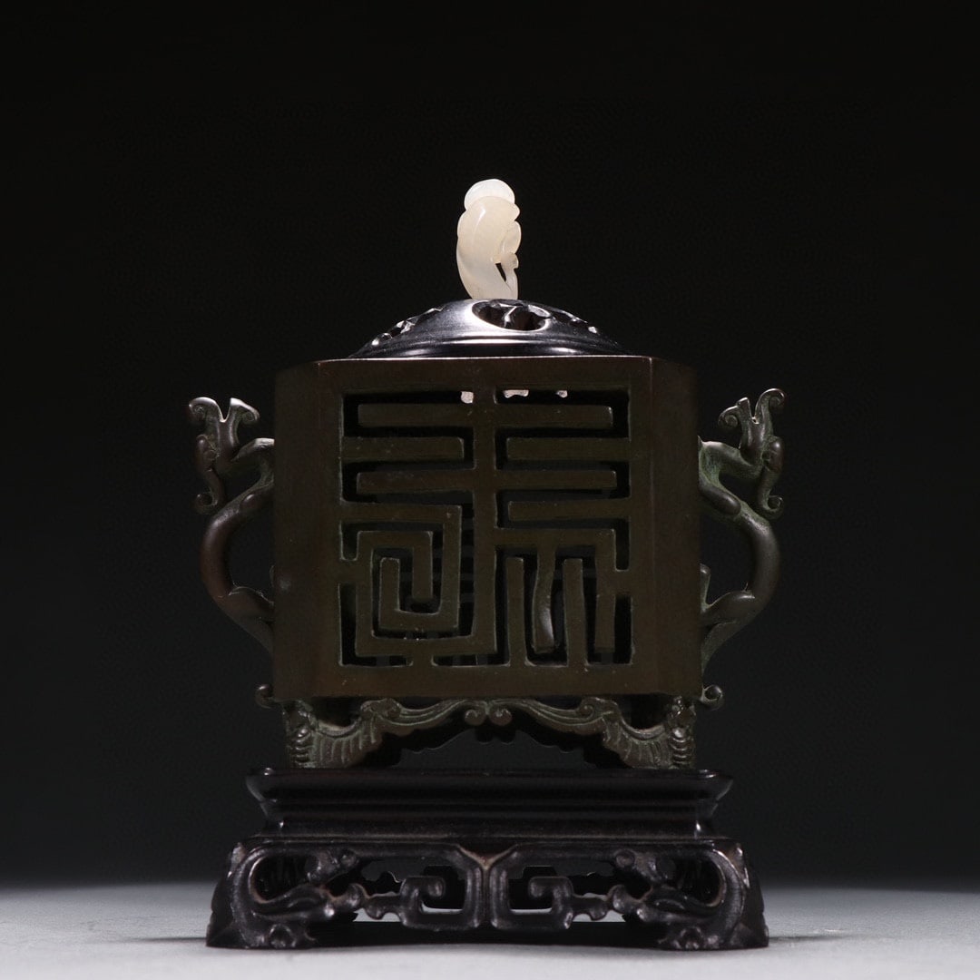 Yutang Qingwan Mark Bronze Openwork Double Dragon Ear Incense Burner: Yutang Qingwan Mark Copper Openwork Double-Dragon Ear Incense Burner: Copper body with openwork decorative patterns, double-dragon ears on both sides, jade-inlaid knob on the lid, base inscribed "Yuta