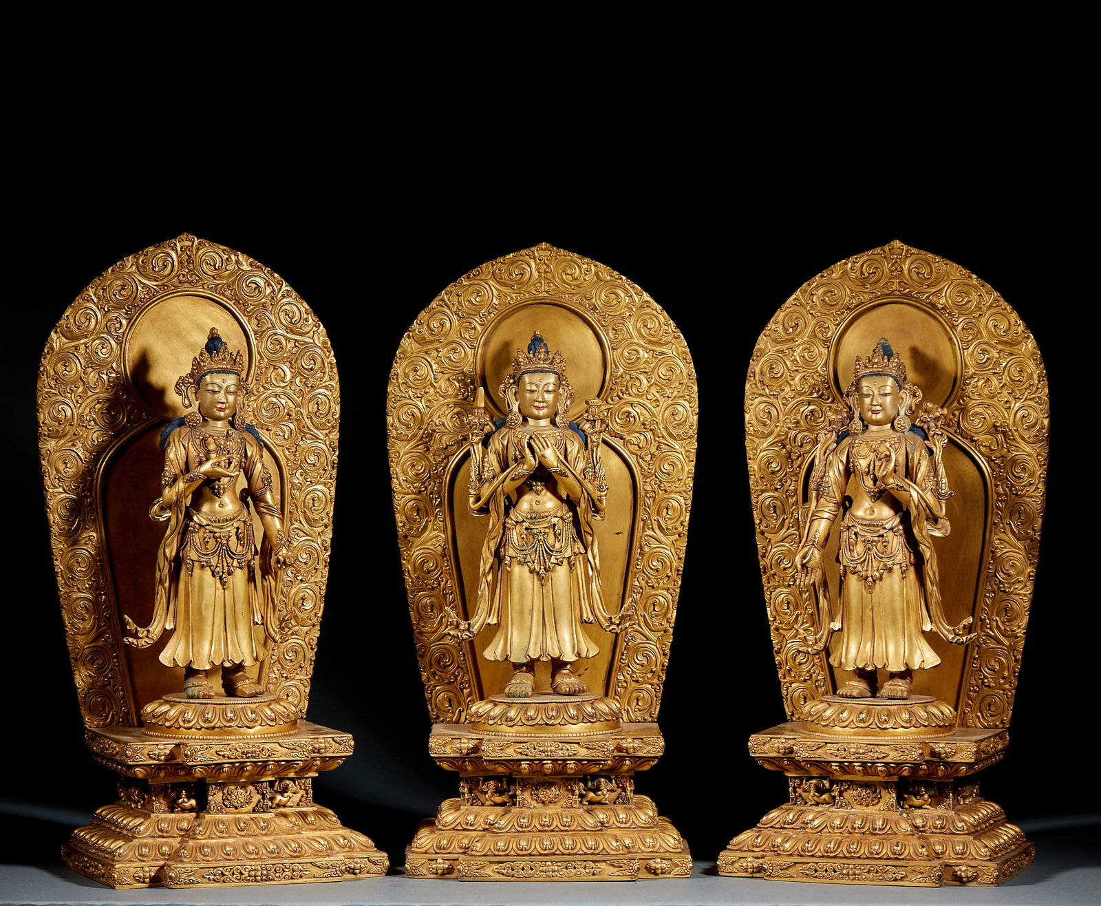 Yongle Mark Gilt Bronze Three Protectors Statue Set: Ming Yongle Gilt Bronze Three Protectors Statue Set: Gilt bronze cast with rigorous religious iconography and thick full gilding, perfectly preserved as a three-piece group. Height 44.5cm, length 20cm