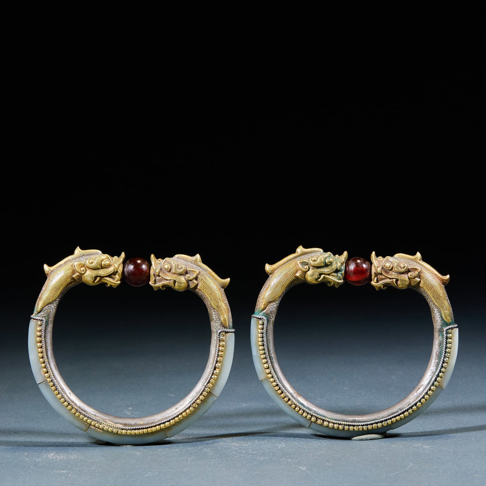 Gilt Silver Hetian Jade Wrapped Dragon Head Bangle Inlaid Agate Beads: Silver-Gilt Hetian Jade Agate-Inlaid Dragon Head Bracelet: Silver-gilt wrapped Hetian jade bracelet carved with dragon head ornament at the terminal, embedded with agate beads, exquisite delicate craf