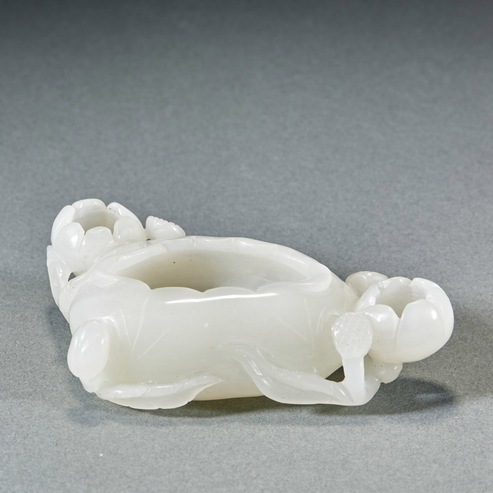 Hetian Jade Lotus Brush Washer: Hetian Jade Lotus Brush Washer: Hetian jade carved into lotus shape, mild moist jade texture and delicate fine carving detail. Height 2.3cm, length 10cm, width 6cm, weight 111g. Elegant literati study