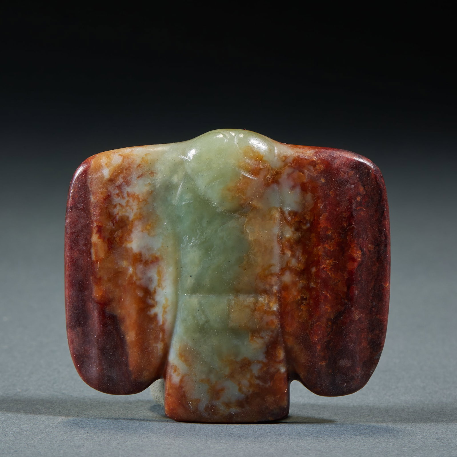 Hongshan Jade Owl: Hongshan Culture Jade Owl: Ancient jade with red aged infiltration, carved into classic jade owl shape conforming to Hongshan cultural characteristics. Length 5.7cm, width 6.3cm, weight 63g. Important