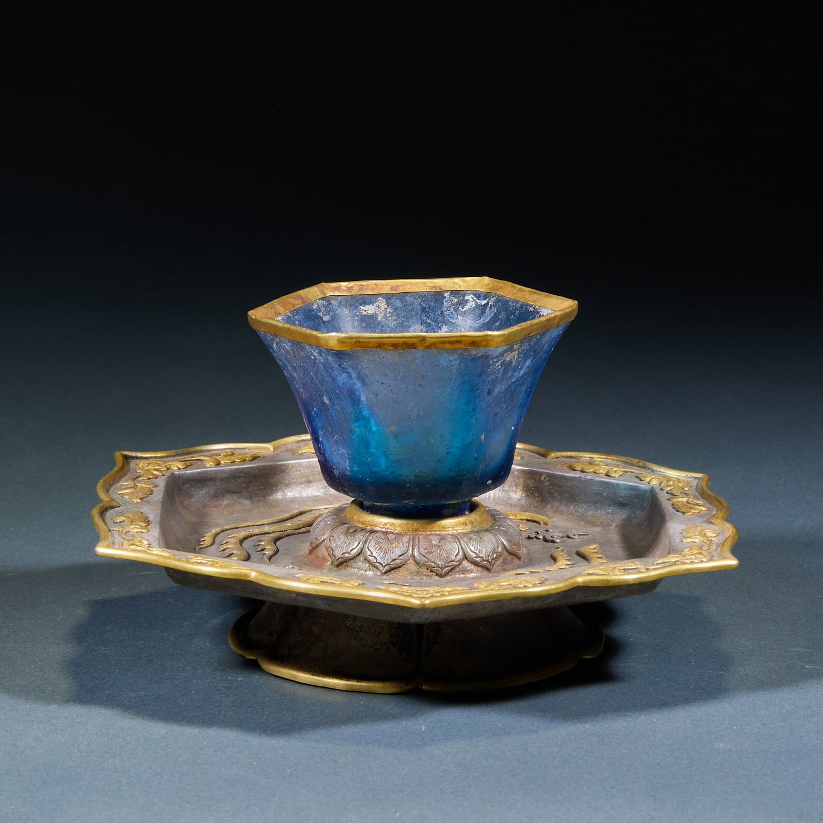 Gilt Silver Colored Glaze Phoenix Cup: Silver-Gilt Glass Phoenix Cup: Silver-gilt matched base paired with blue glass cup, base chased with phoenix patterns, exquisite gorgeous craft. Height 8.5cm, diameter 16.3cm, weight 320g. Matched pai