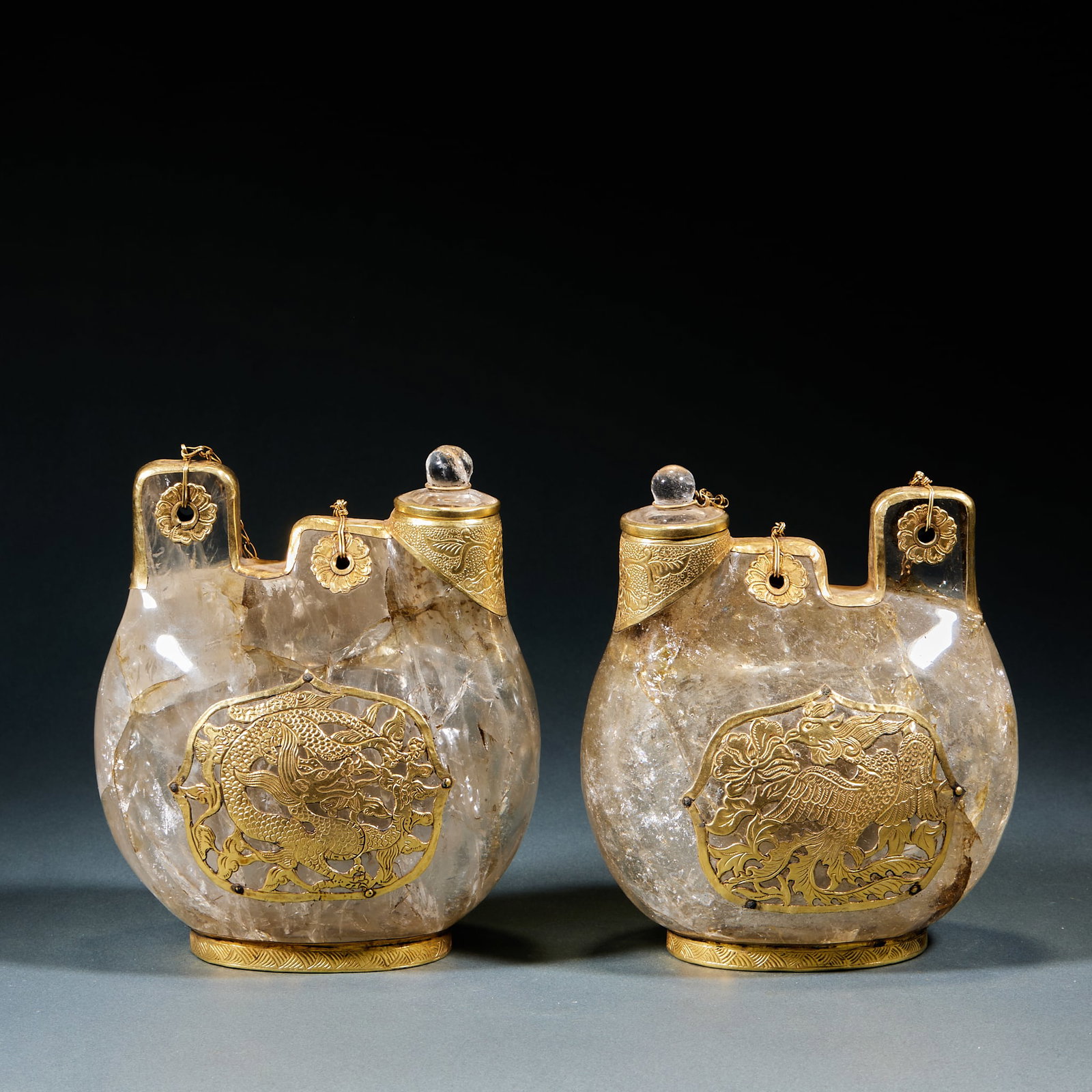 Crystal Inlaid Dragon and Phoenix Pattern Leather Bag Pot, A Pair: Crystal Gold-Inlaid Dragon Phoenix Leather Bag Pot Pair: Natural crystal with gold wrapping craft, inlaid dragon and phoenix decorative patterns, imitating ethnic leather bag pot shape. Height 15.5cm,