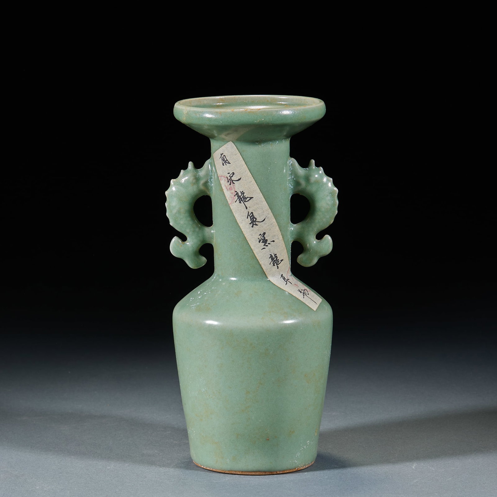 Southern Song Longquan Kiln Dragon Ear Vase: Southern Song Longquan Kiln Dragon Ear Vase: Porcelain body covered with celadon glaze, dragon-shaped ears on both sides, mild lustrous glaze and neat elegant vessel form. Height 24cm, diameter 10cm. 