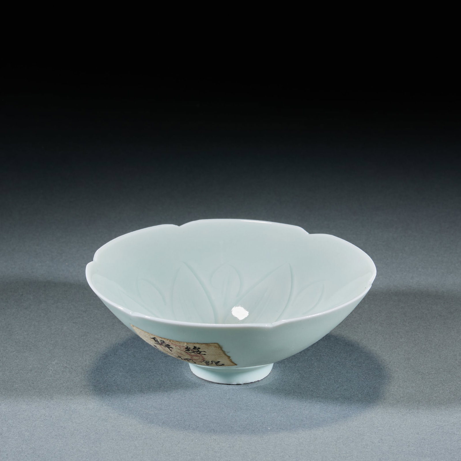 Song Dynasty Hutian Kiln Shadow Green Glaze Carved Longevity Turtle Conical Bowl: Song Hutian Kiln Shadow Celadon Carved Douli Cup: Porcelain with shadow celadon glaze, interior carved floral patterns, thin body and smooth glaze in classic douli hat shape. Height 5cm, diameter 13cm