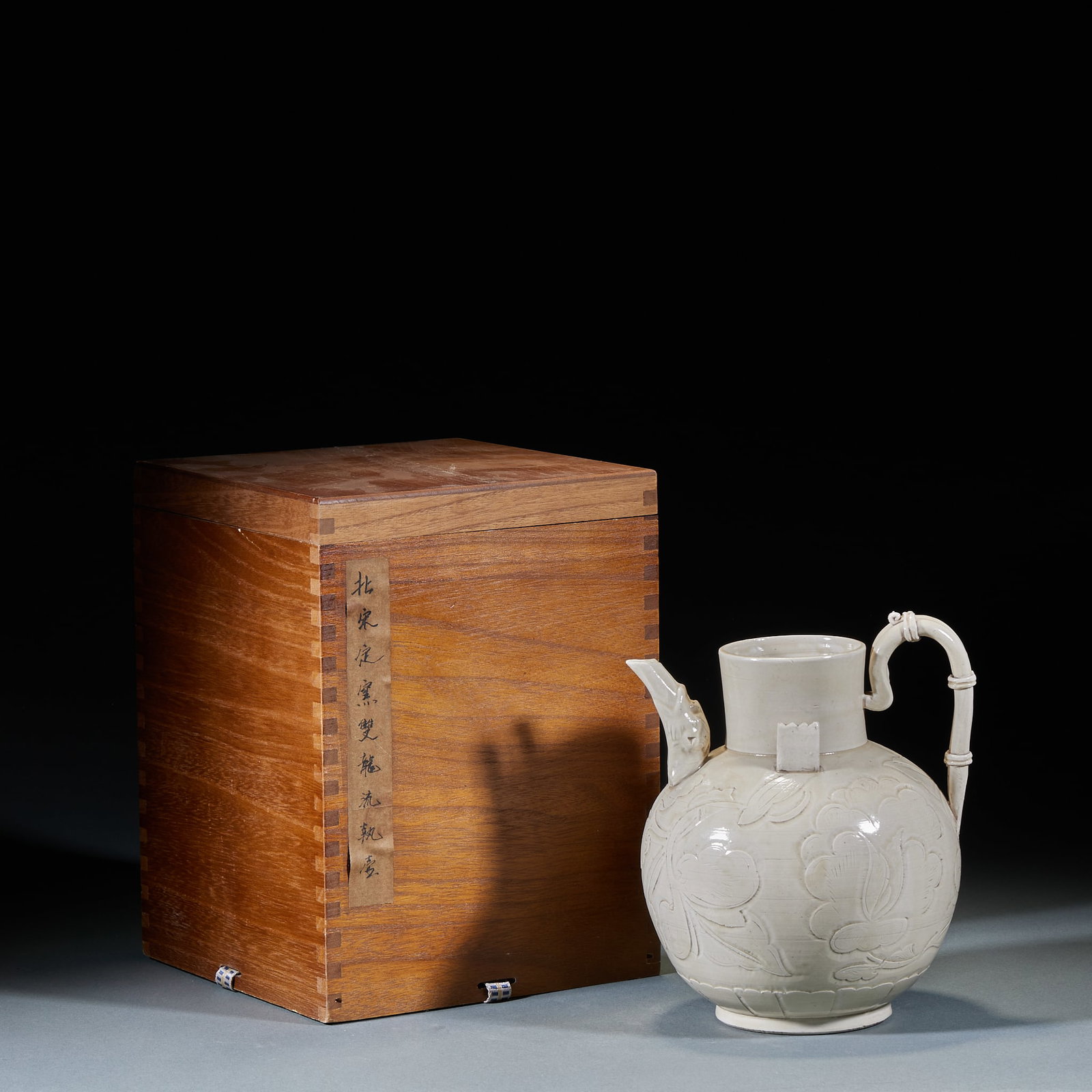 Northern Song Ding Kiln Double Dragon Spout Ewer: Northern Song Ding Kiln Double-Dragon Spout Ewer: White glaze with incised floral lines, double-dragon sculptured spout, pure lustrous ivory-white glaze. Height 22cm, diameter 17cm. Rare Northern Song