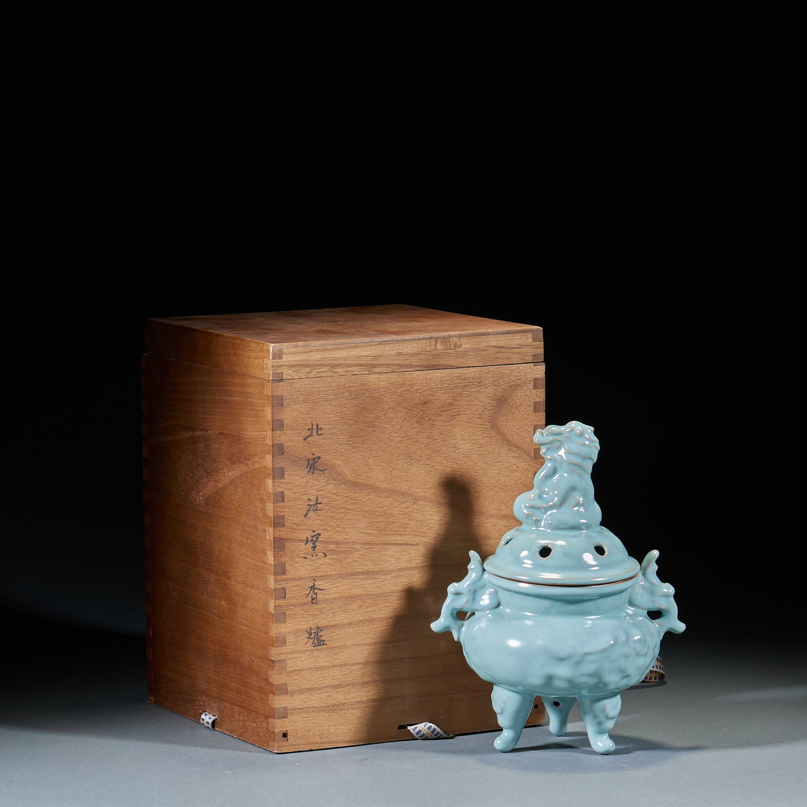Northern Song Ru Kiln Incense Burner: Northern Song Ru Kiln Incense Burner: Sky-celadon glaze with lion knob and three-foot structure, smooth jade-like glaze texture. Height 22.5cm, diameter 17.5cm. Representative Northern Song Ru Kiln ma
