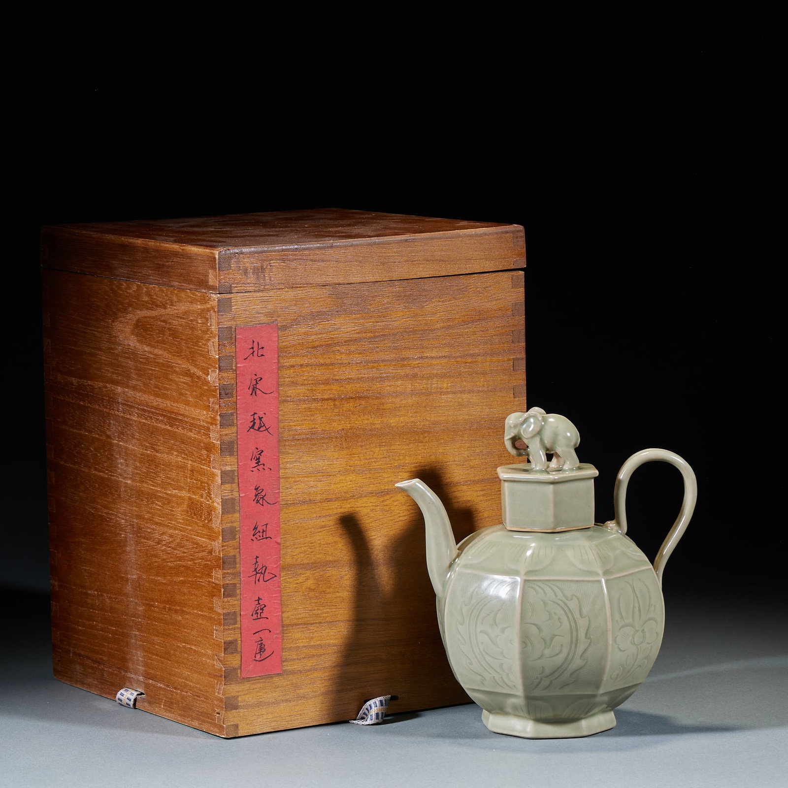 Northern Song Yue Kiln Elephant Knob Ewer: Northern Song Yue Kiln Elephant Knob Ewer: Celadon glaze with elephant-shaped knob on the lid, body carved with delicate floral patterns. Height 18cm, length 17cm, width 12cm. Fine Northern Song Yue K