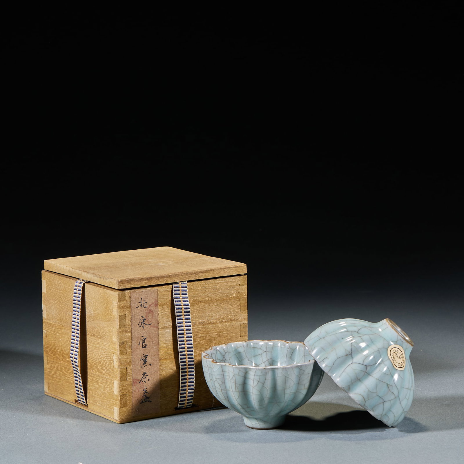 Northern Song Official Kiln Teacup: Northern Song Official Kiln Tea Cup: Celadon glaze with natural crackle, flower mouth design, primitive elegant mild glaze. Height 5.5cm, diameter 9cm. Representative Northern Song Official Kiln tea w