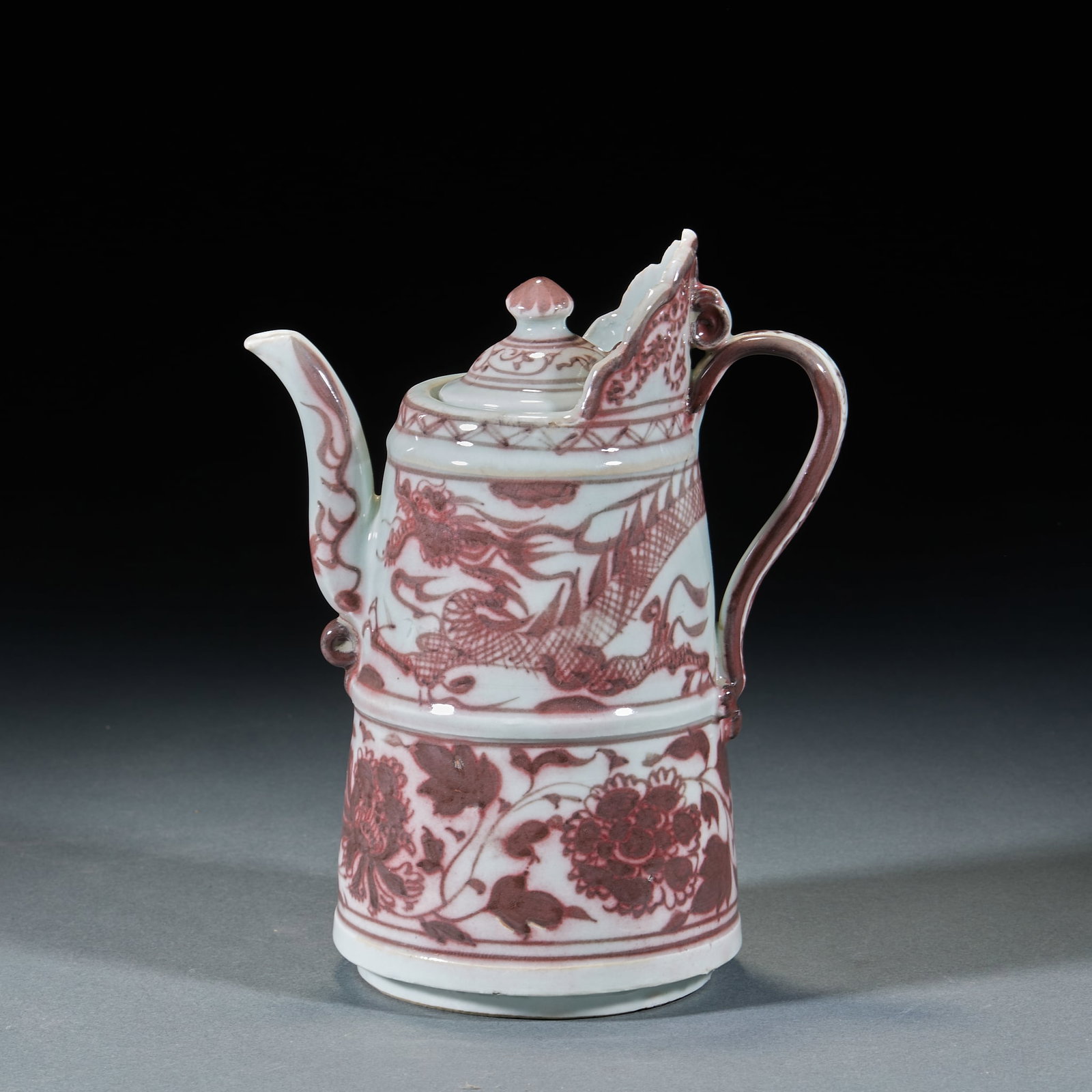 Yuan Dynasty Underglaze Red Duomu Pot: Yuan Underglaze Red Duomu Pot: Porcelain painted with underglaze red dragon and floral patterns, modeled after Tibetan-style Duomu pot shape. Height 21cm, length 16cm, width 11cm. Rare Yuan underglaze